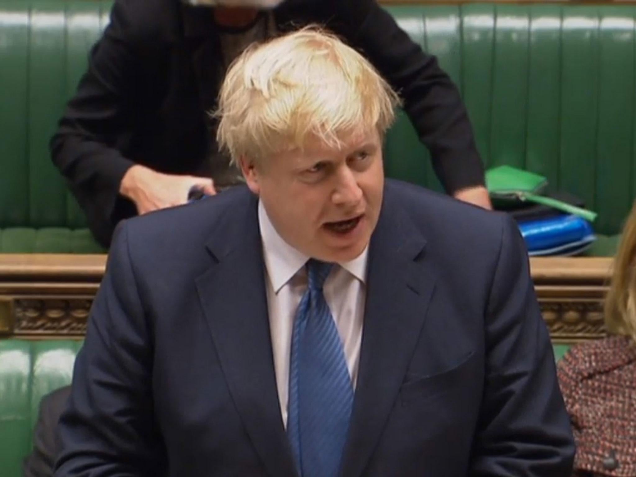 Boris Johnson answering questions about Donald Trump's executive order