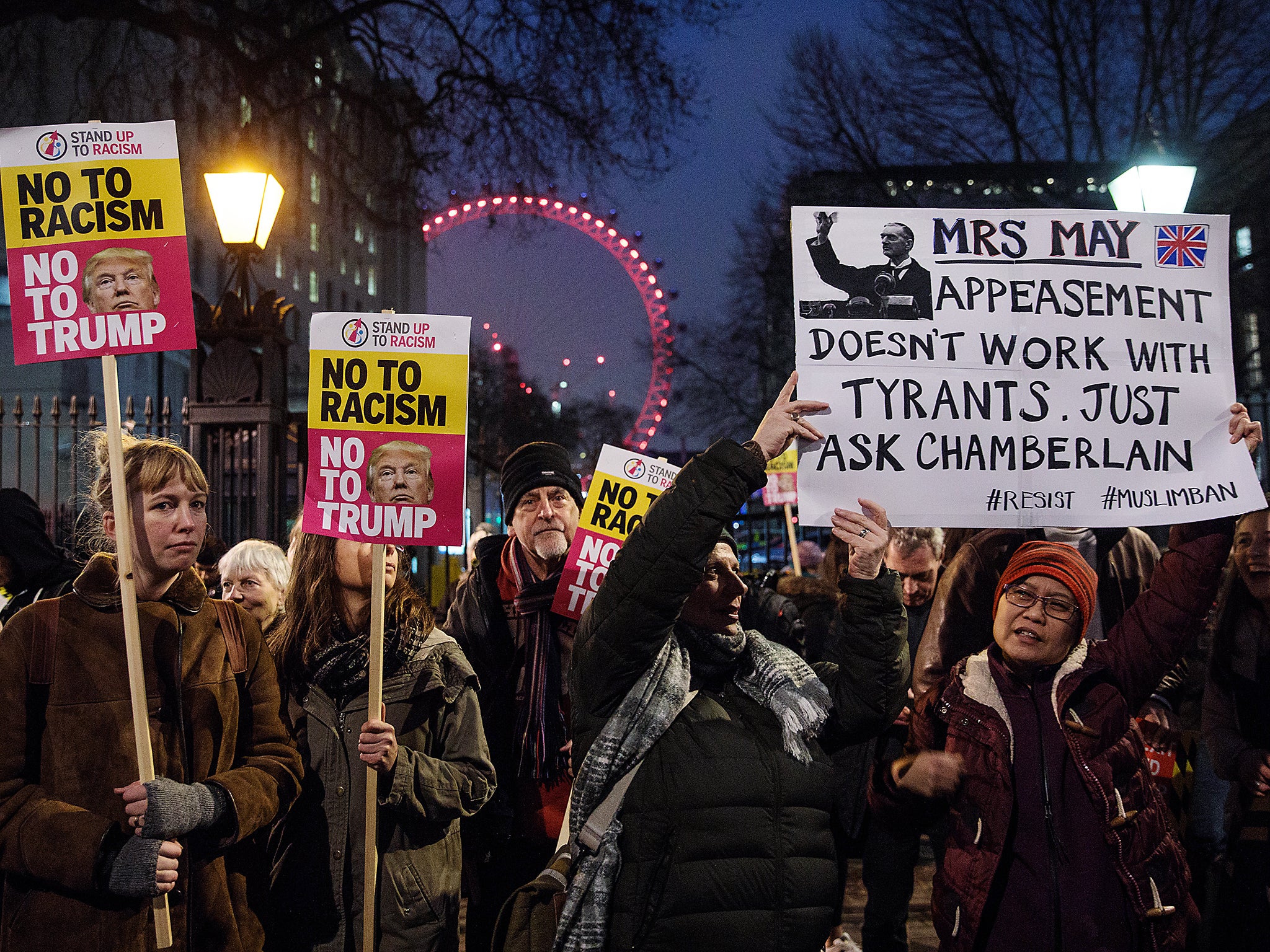 Demonstrators holding placards attend a protest outside Downing Street against U.S. President Donald Trump's ban on travel from seven Muslim countries in London