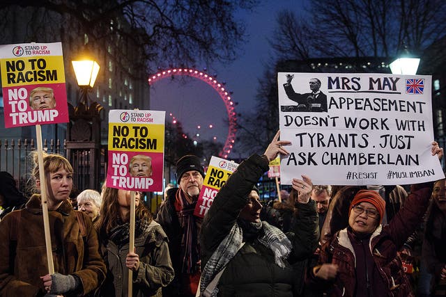 Demonstrators holding placards attend a protest outside Downing Street against U.S. President Donald Trump's ban on travel from seven Muslim countries in London