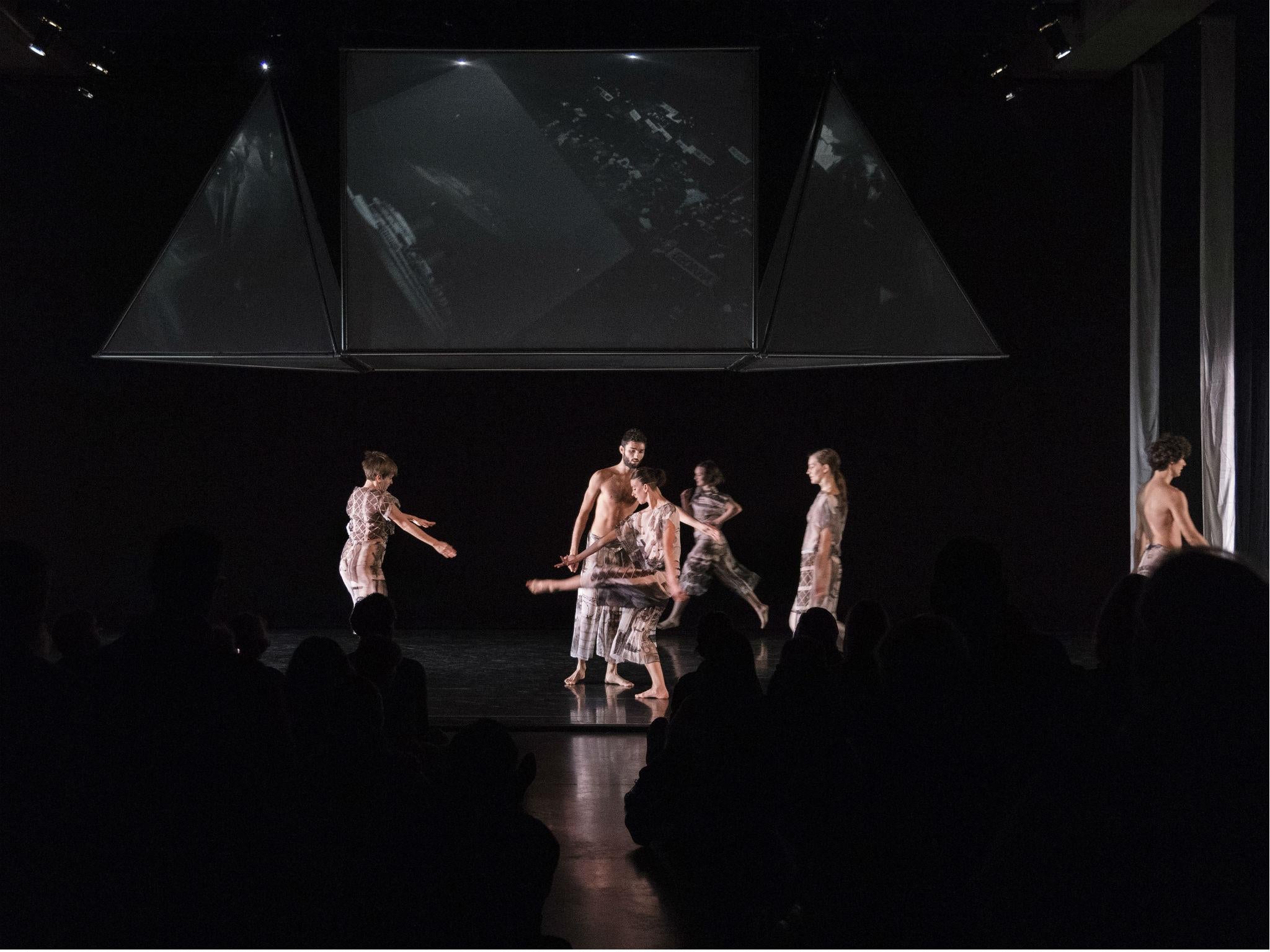 The cast of Trisha Brown's 'Set and Reset' performing in Tate Modern's The Tank