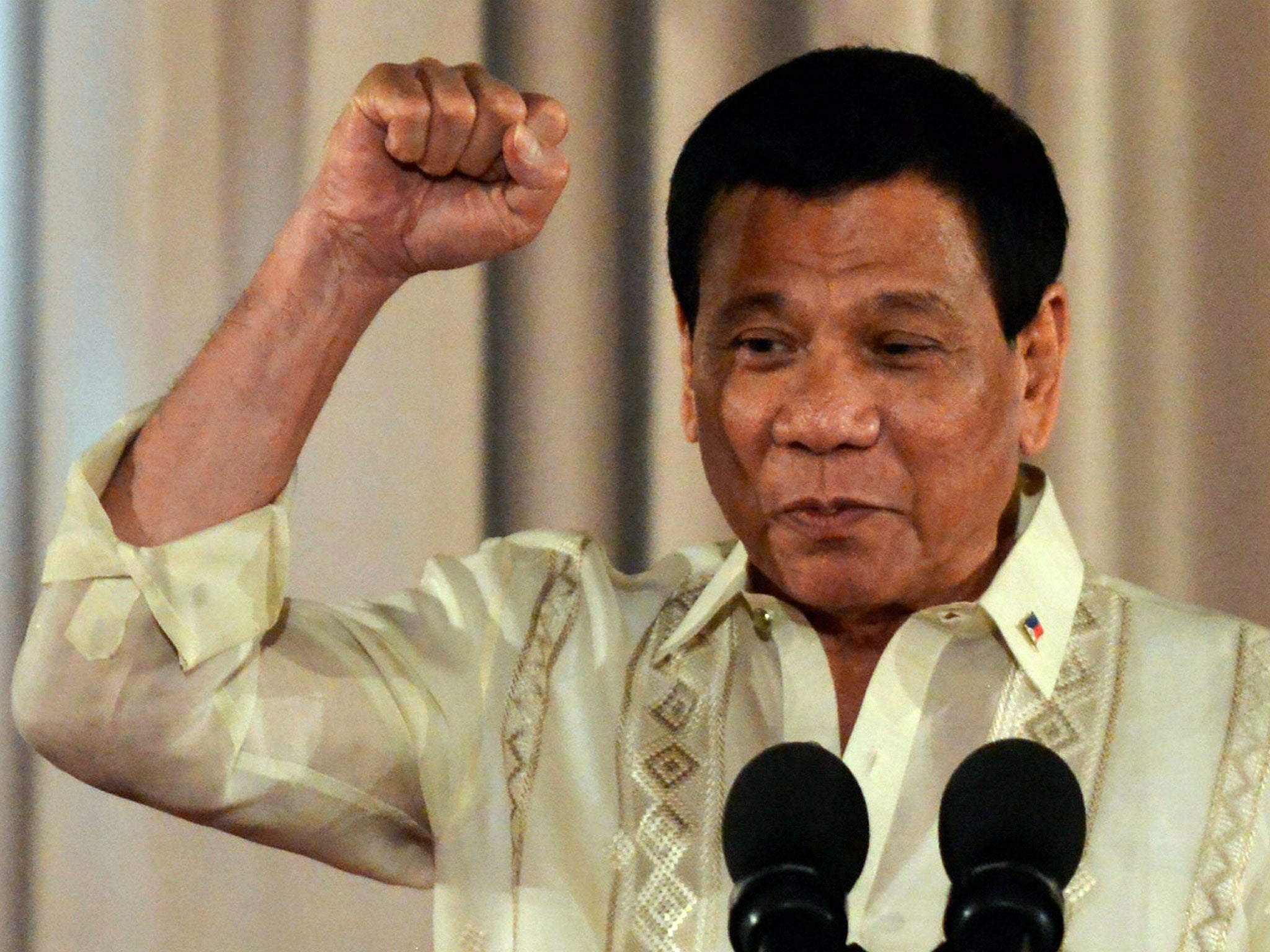 Philippine President Rodrigo Duterte gestures while speaking during the oathtaking ceremony for newly appointed generals of the Armed Forces of the Philippines at the presidential palace in Manila on 31 January, 2017