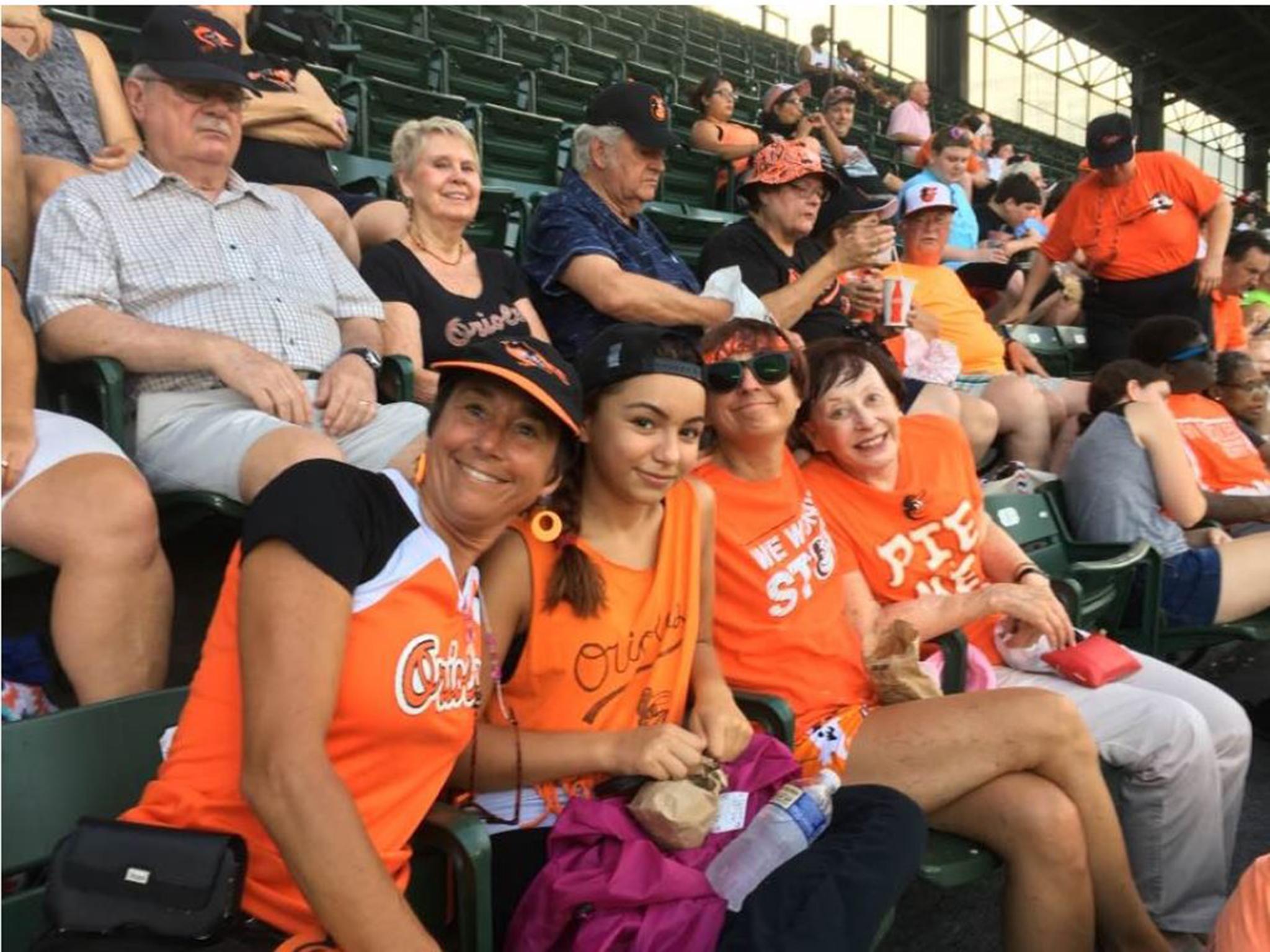 Charlotte, 16, cheers for the Orioles with her aunt, Mary Helen Sprecher (left), her mother and grandmother, Zelma Holzgang