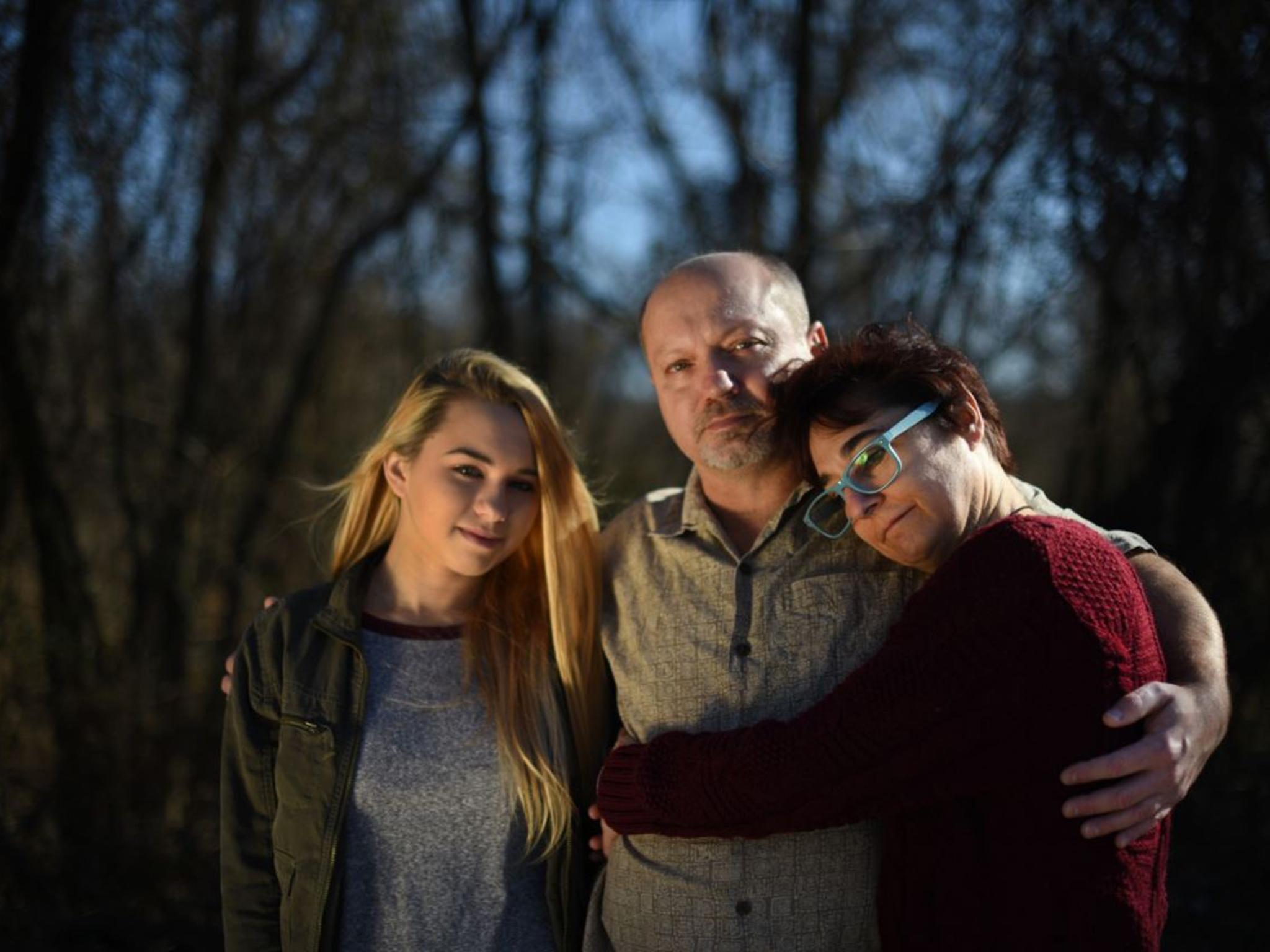 Charlotte Zaremba’s family — sister Audrey, father Jim and mother Suzanne — stand outside their Ellicott City, Md., home, where the 16-year-old was shot to death by a high school classmate on New Year’s Day