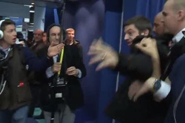 A French journalist was violently forced out of an exhibition hall by security guards after he asked Marine Le Pen a tough question