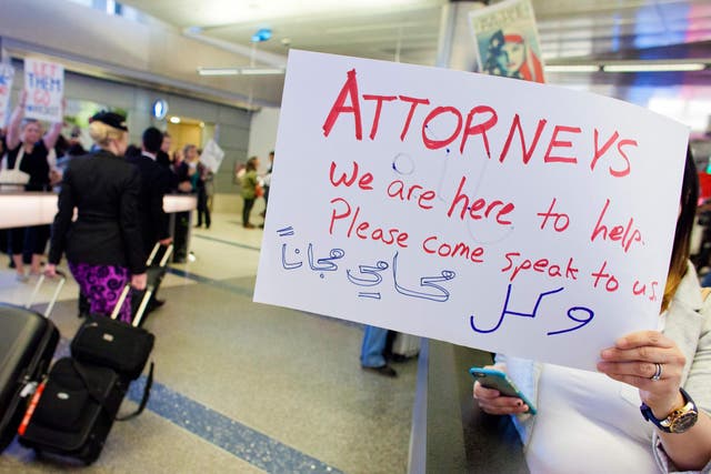 Volunteer lawyers join protesters at Los Angeles International airport, offering free legal assistance to stranded Muslims