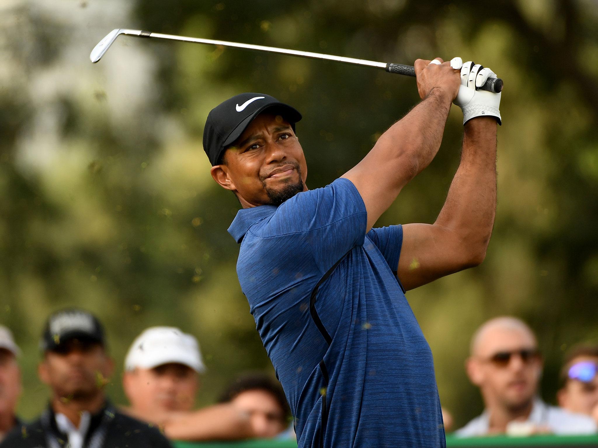 Tiger Woods has withdrawn from the Dubai Desert Classic with a 'bad back'