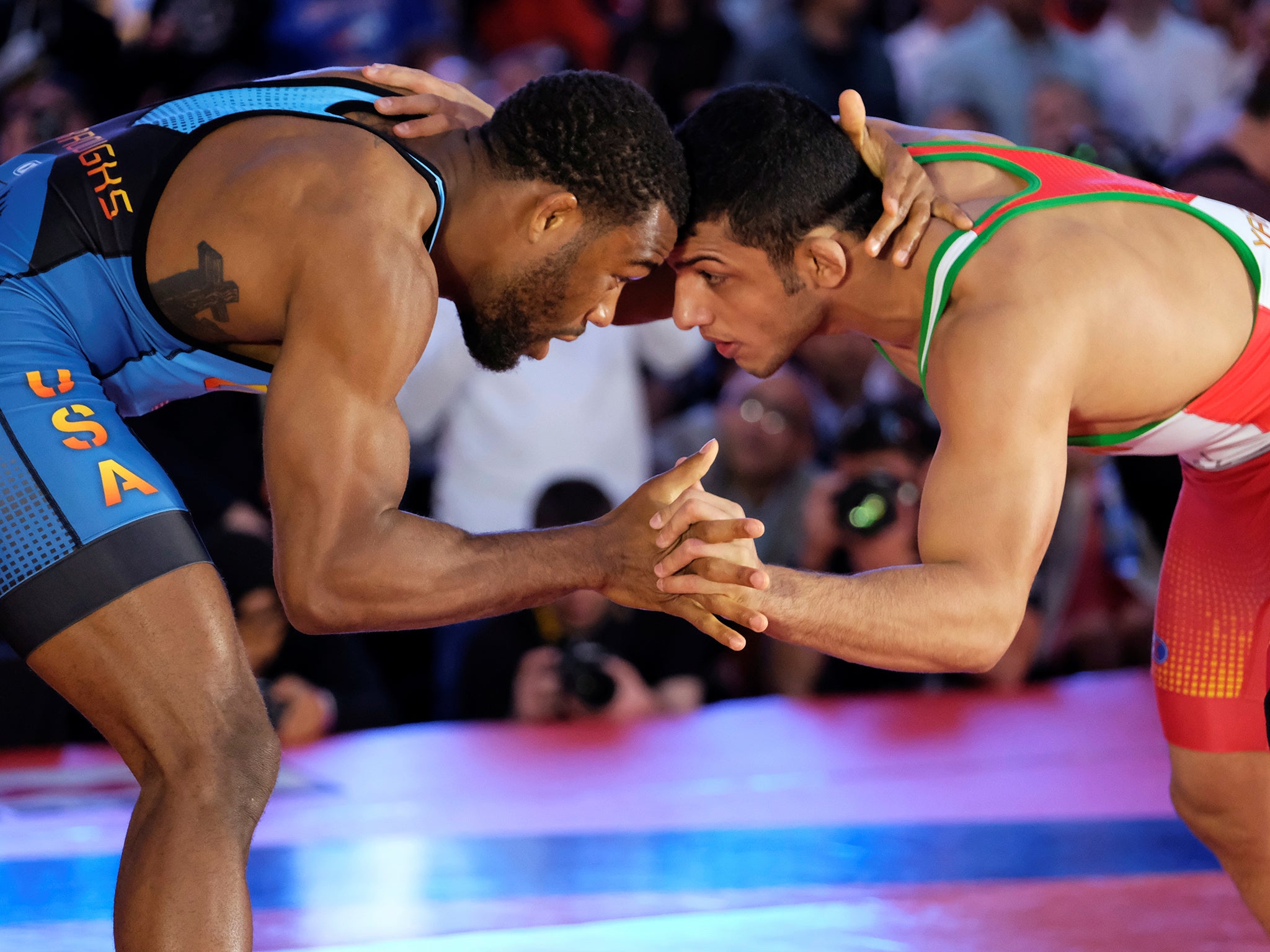 US wrestler Jordan Burroughs competes against Iran's Peyman Yarahmadi in Times Square, New York, on May 19 2016