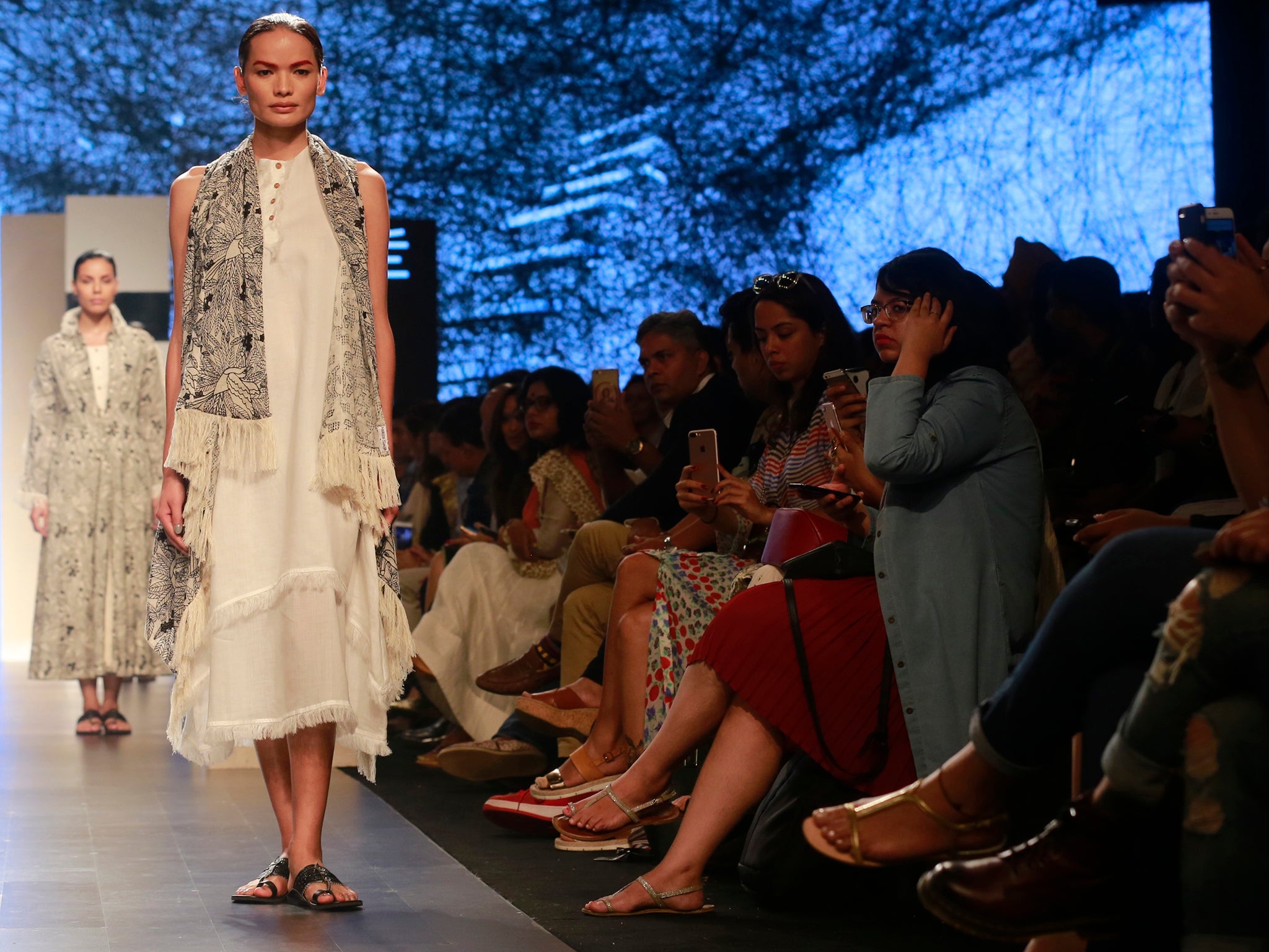 Lama models a creation by designer Gen Next during Lakme Fashion Week