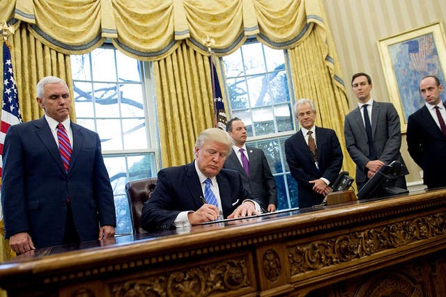 President Trump signs executive orders January 23, 2017.
