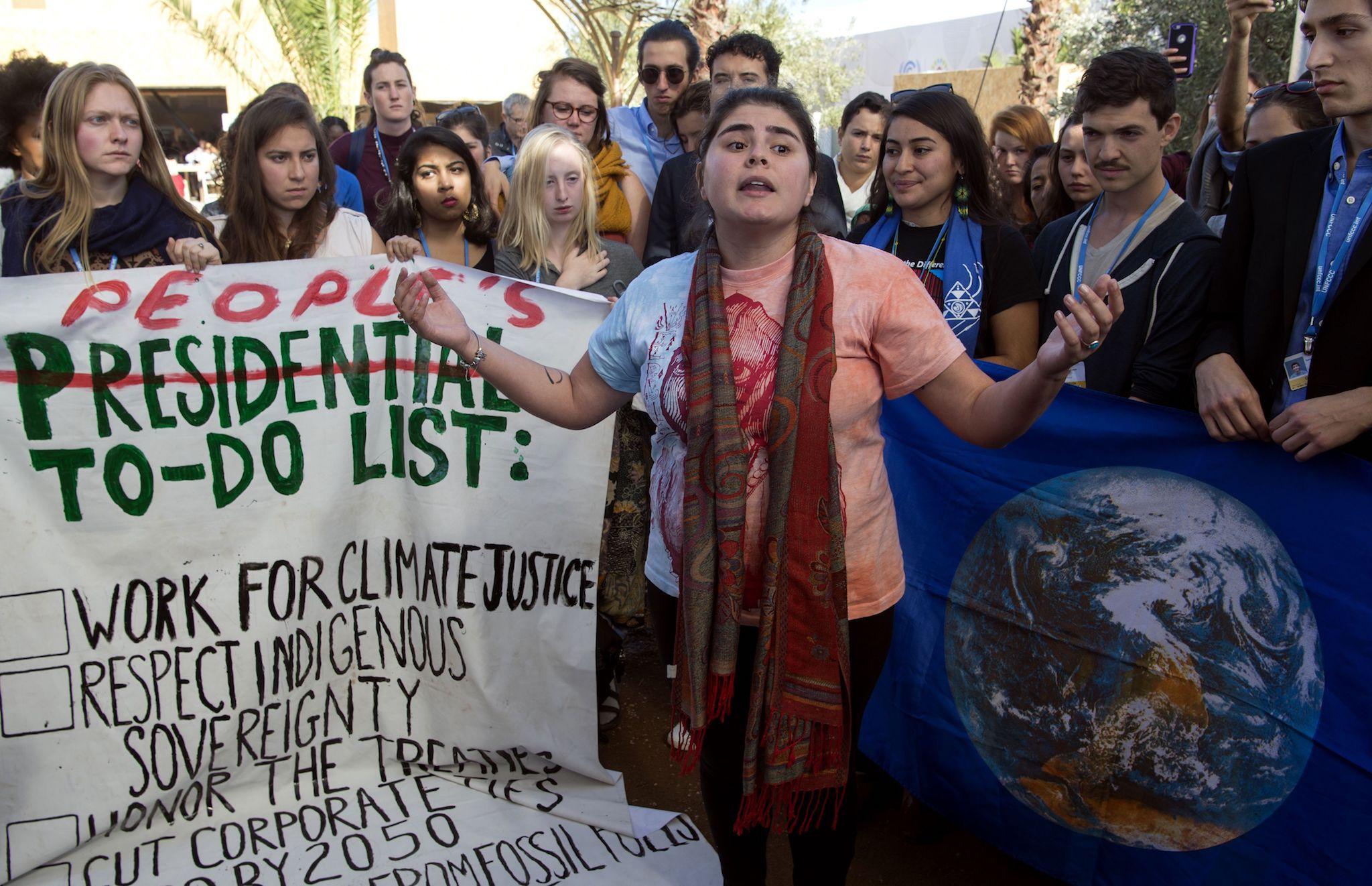 American students protest outside the UN climate talks during the COP22 international climate conference in Marrakesh in reaction to Donald Trump's victory in the US presidential election, on November 9, 2016