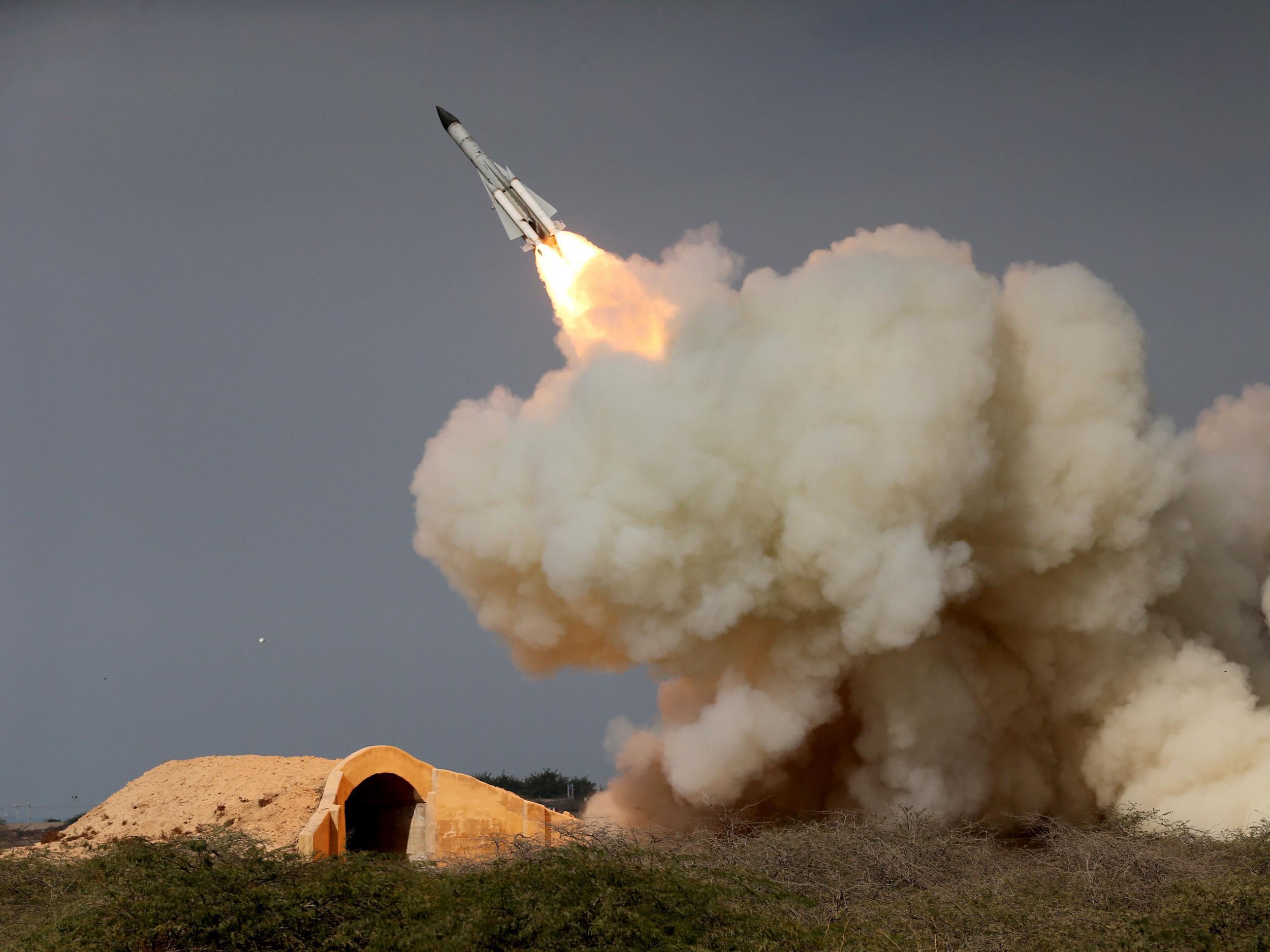 Image released by Iranian Students News Agency (ISNA) shows a long-range S-200 missile being fired in a military drill in the port city of Bushehr, Iran