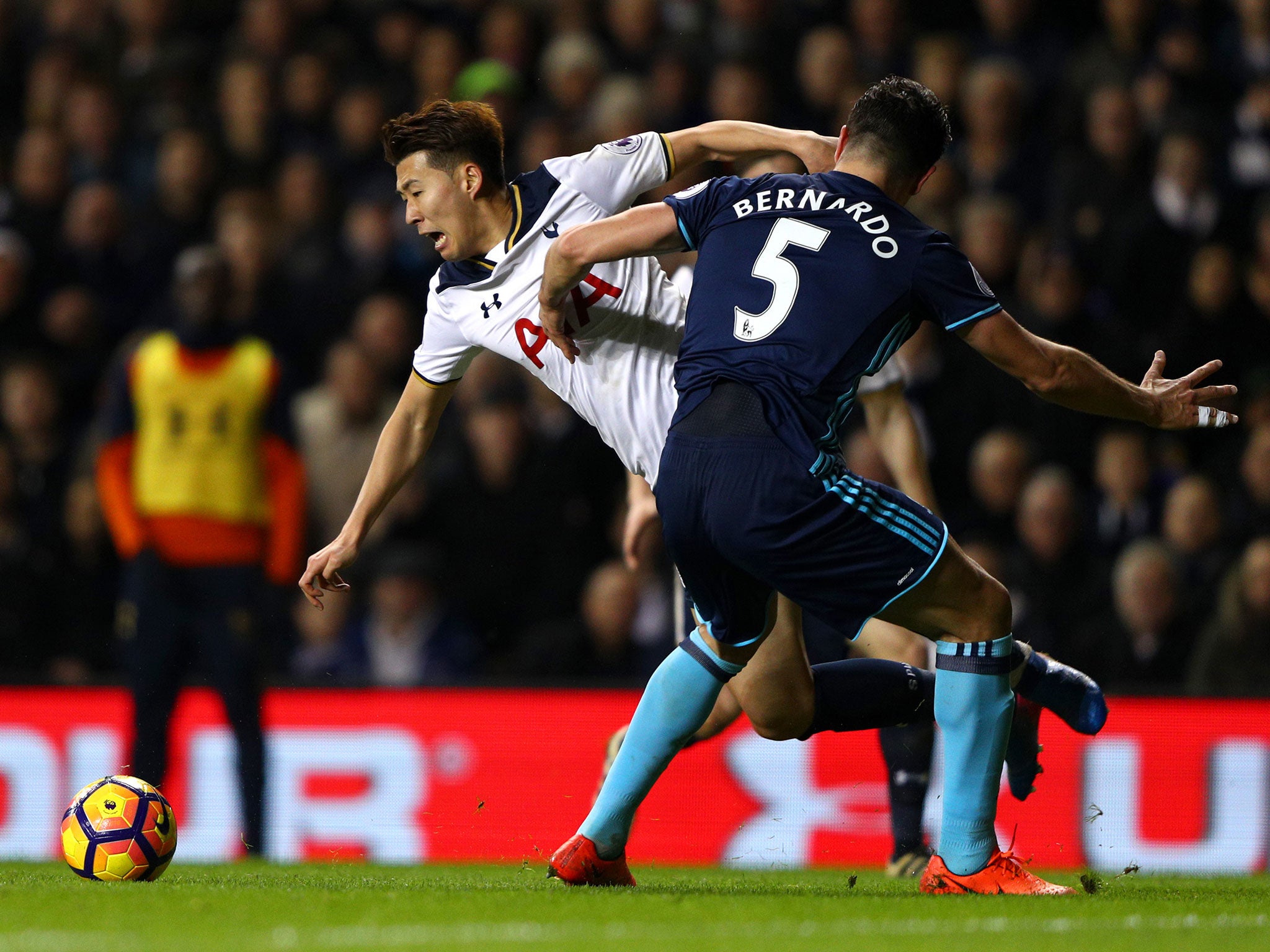 &#13;
Son Heung-Min was brought down by Bernardo for the Tottenham penalty &#13;