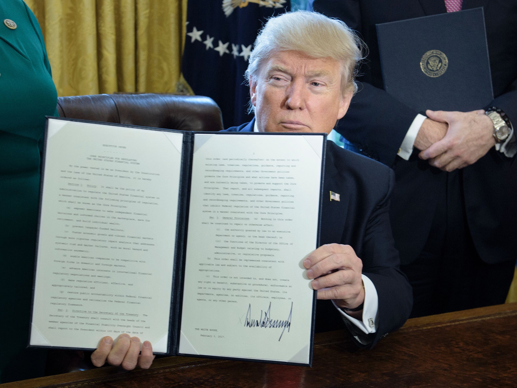 Trump shows executive order aimed at 'cutting a lot out of' Dodd Frank
