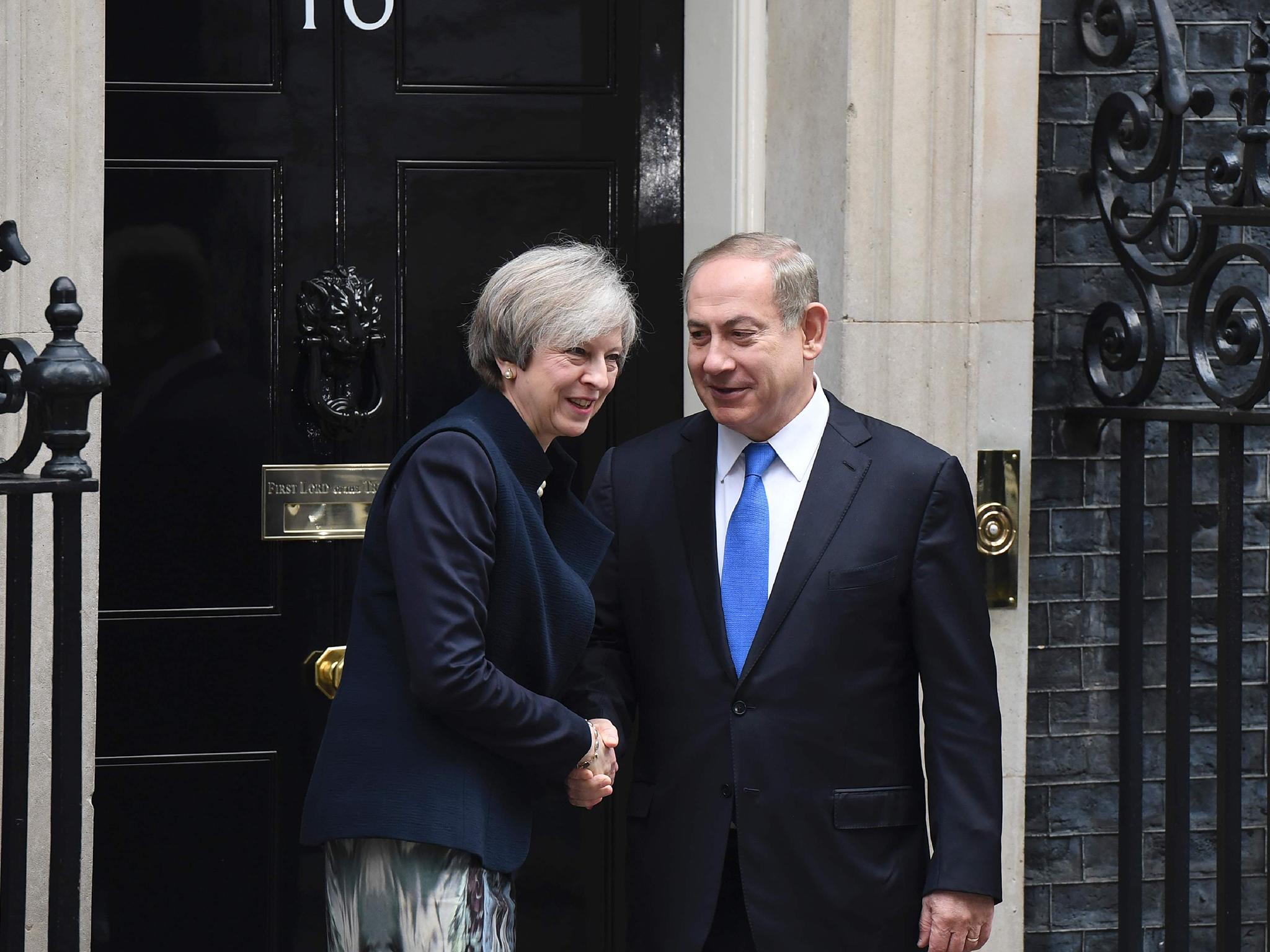 Theresa May shaking hands with Israeli Prime Minister Benjamin Netanyahu after Netanyahu arrived for a meeting at 10 Downing Street in central London