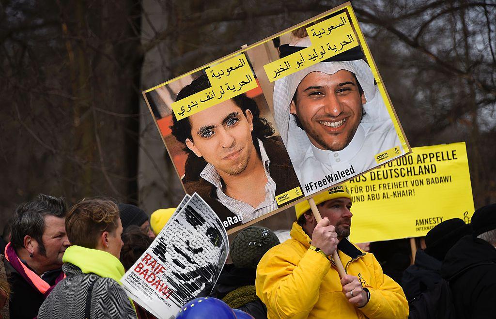 Demonstrators in Berlin protest outside Germany's Saudi Arabian embassy on January 8 2016 against the detention of Saudi blogger  Raif Badawi and human rights activist and lawyer Waleed Abu Alkhair. Both men remain in prison and face lashes for charges re