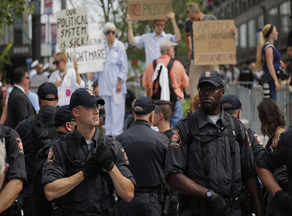 Police and protesters mingle with the public on Cleveland Public Square on the final day of the Republican National Convention on July 21, 2016 in Cleveland, Ohio.