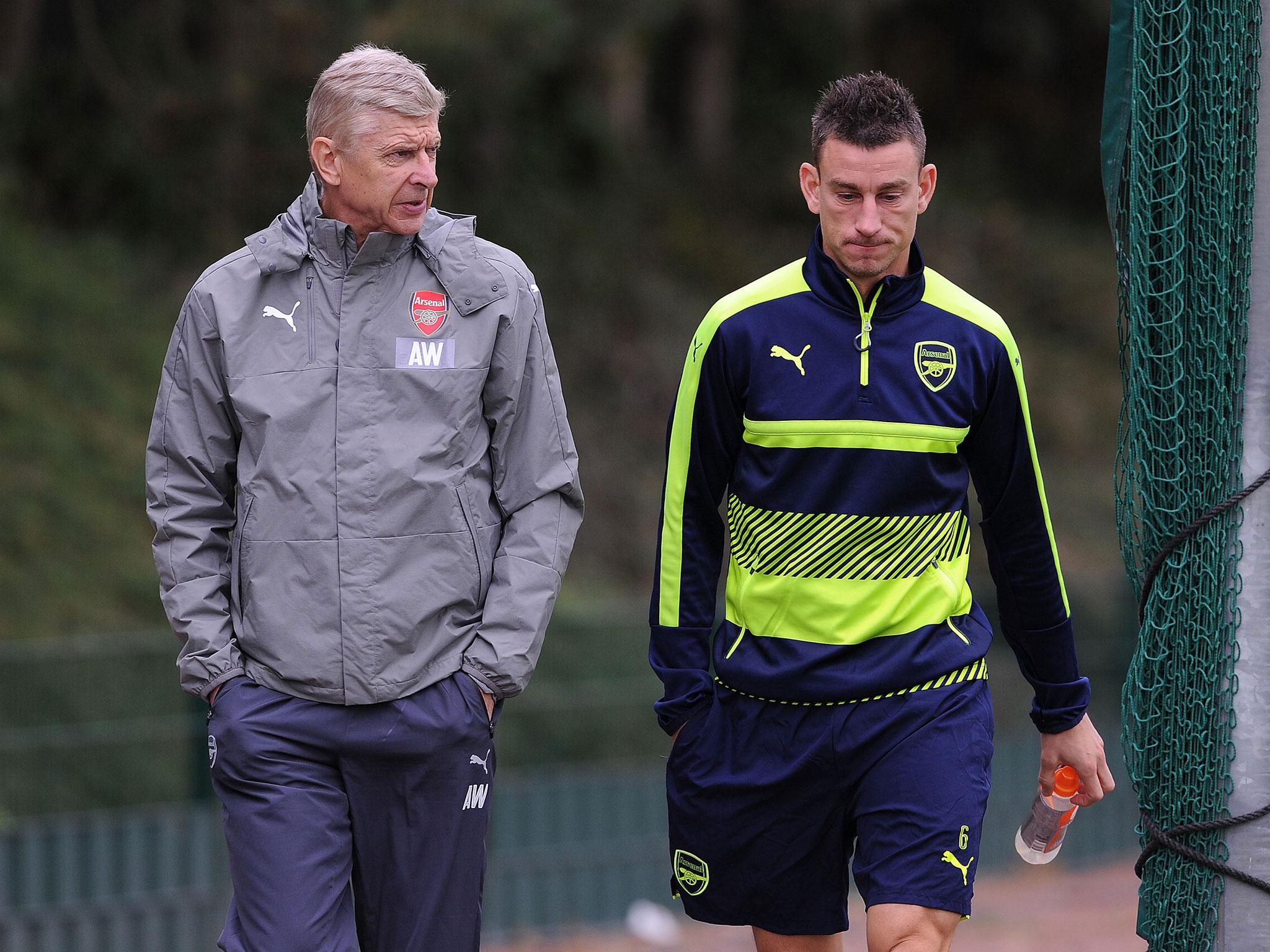 Laurent Koscielny (right) has questioned Arsene Wenger (left) for his team selection against Chelsea