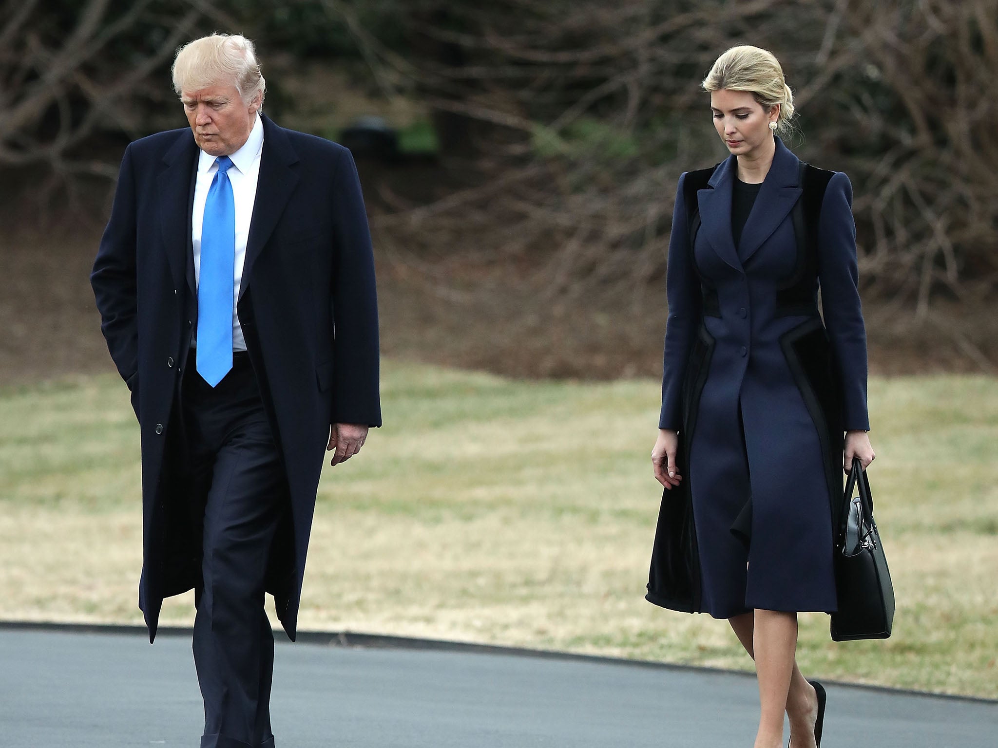 Donald Trump and his daughter Ivanka walk towards Marine One to head to Delaware where the body of the Navy SEAL killed in the Yemen raid returns to the US