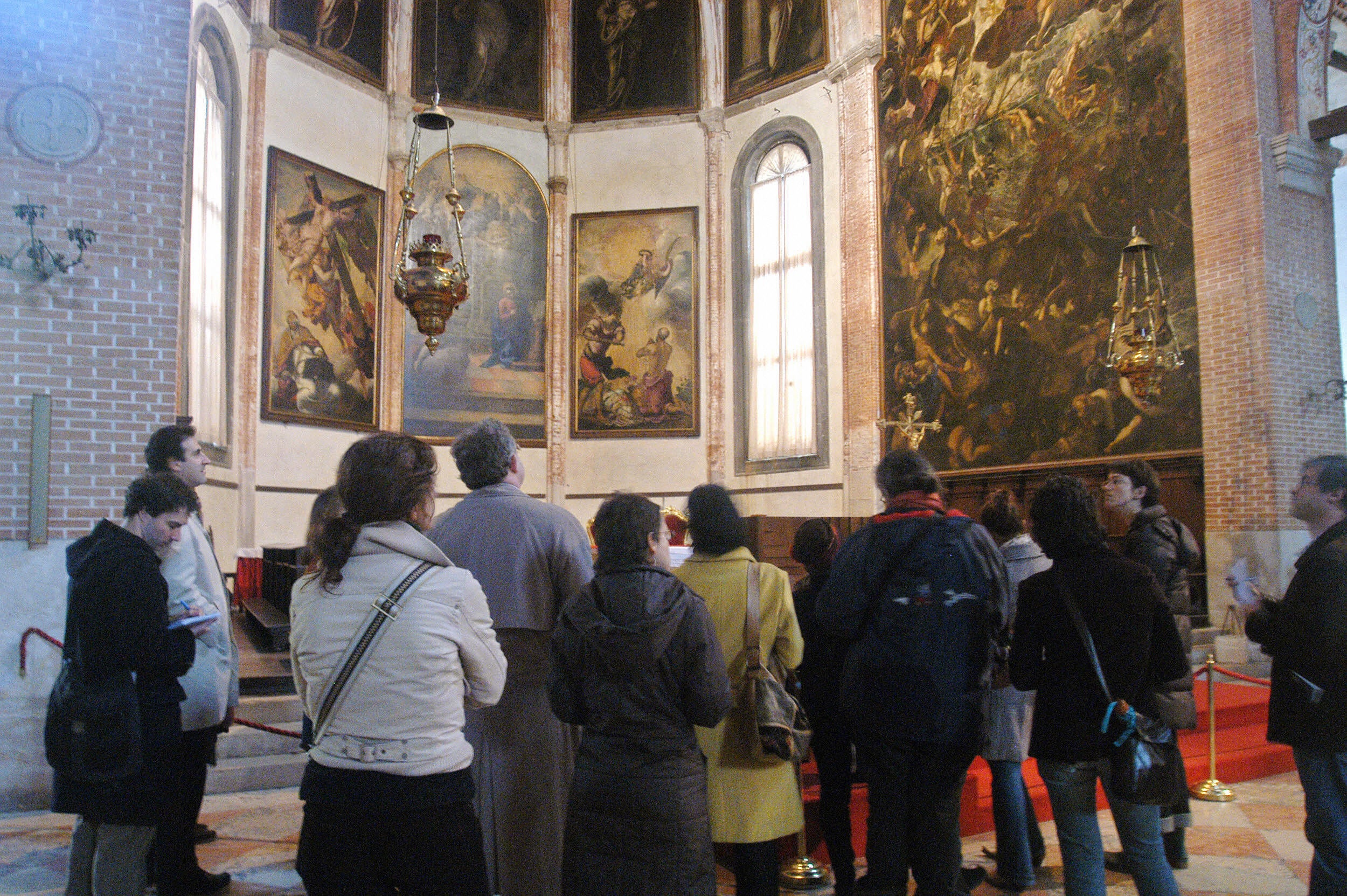 Visitors admire the paintings in Madonna dell'Orto church (AFP/Getty)