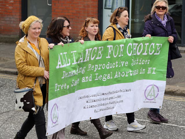 Pro-choice campaigners taking part in a demonstration through Belfast city centre in protest at Northern Ireland's restrictive abortion law