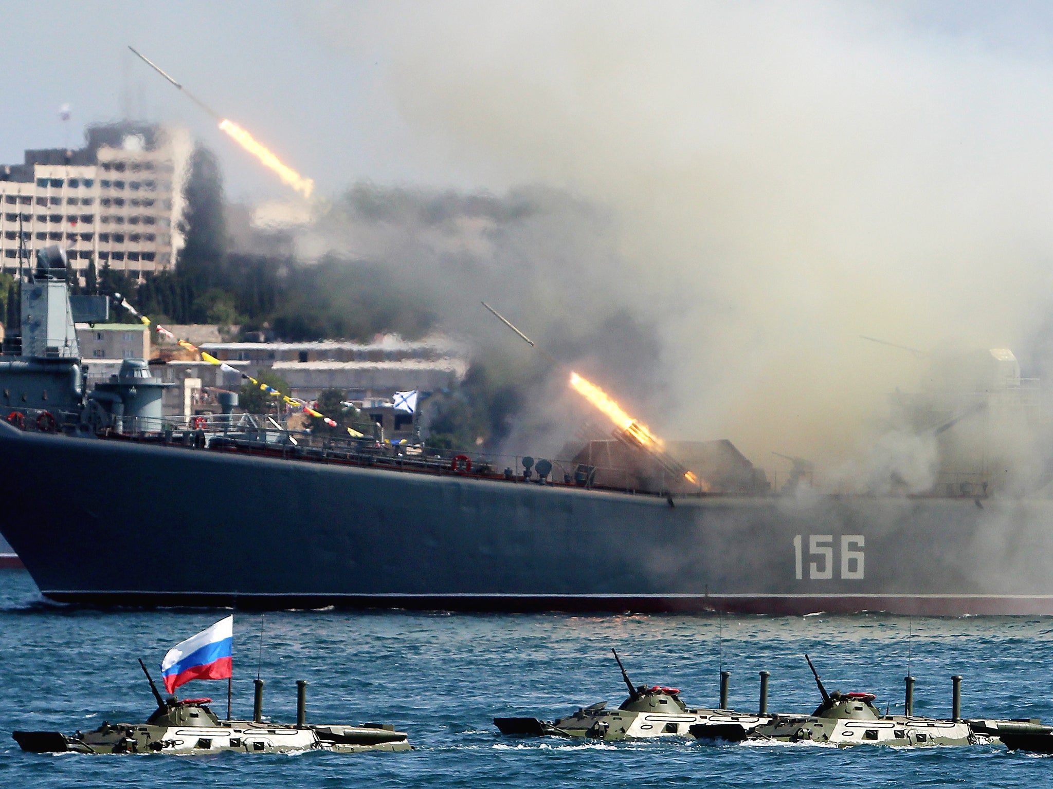 A Russian warship fires rockets during the country's Navy Day celebrations (file pic)