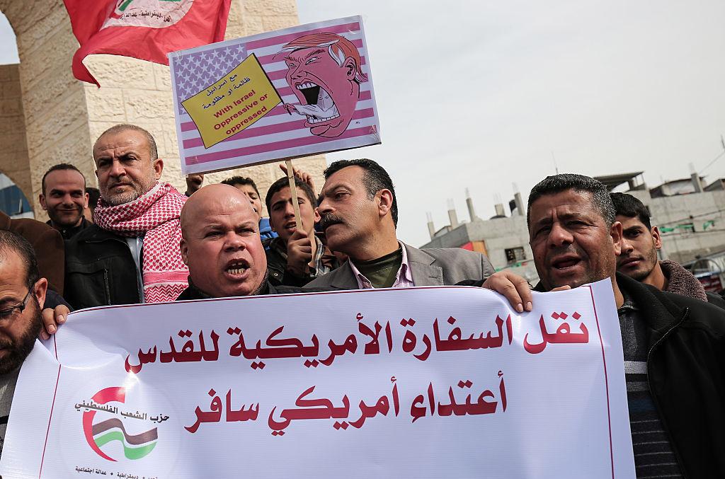 Palestinians protest against Donald Trump's campaign promise to move the US Embassy to Israel to the contested city of Jerusalem in a protest in Rafah, Gaza on January 24, 2017