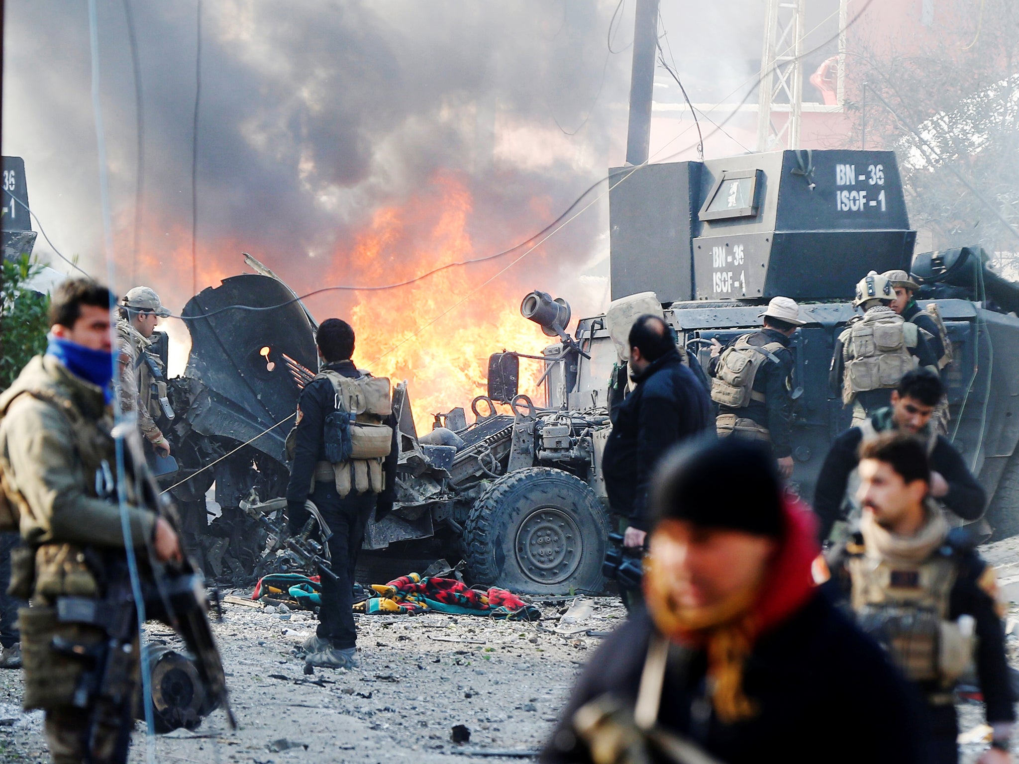 The devastation of a car bomb as Iraqi special forces attempt to clear Isis from the Al Andalus district of Mosul last month