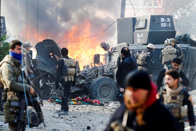 The devastation of a car bomb as Iraqi special forces attempt to clear Isis from the Al Andalus district of Mosul last month