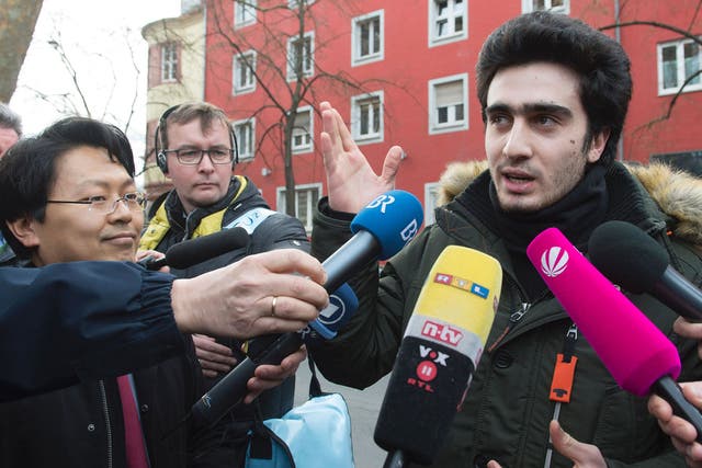 Syrian refugee Anas Modamani and his lawyer Chan-jo Jun at the district court in Wurzburg, Germany, on 6 Februaru