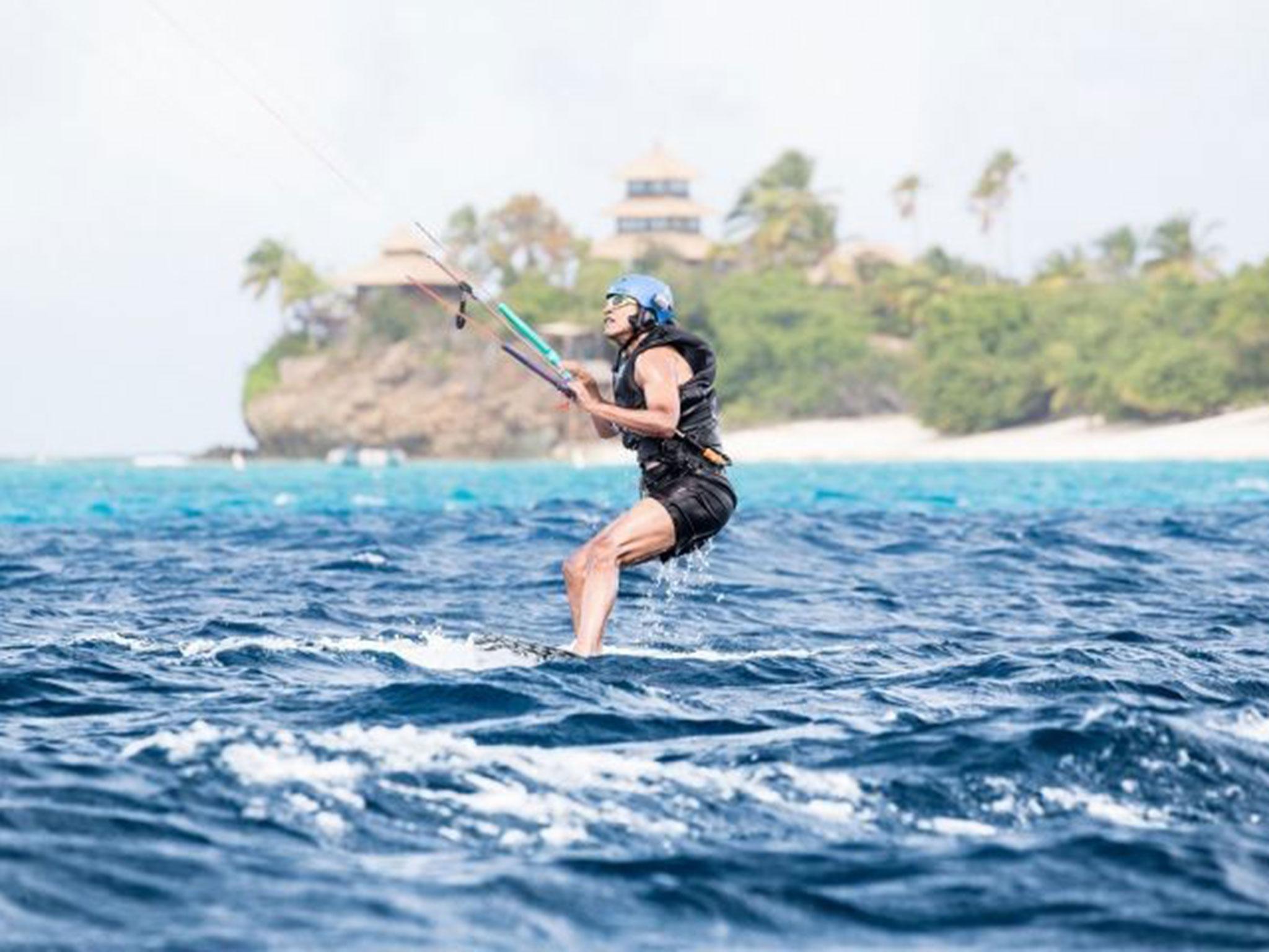 The former President tries his hand at kite surfing