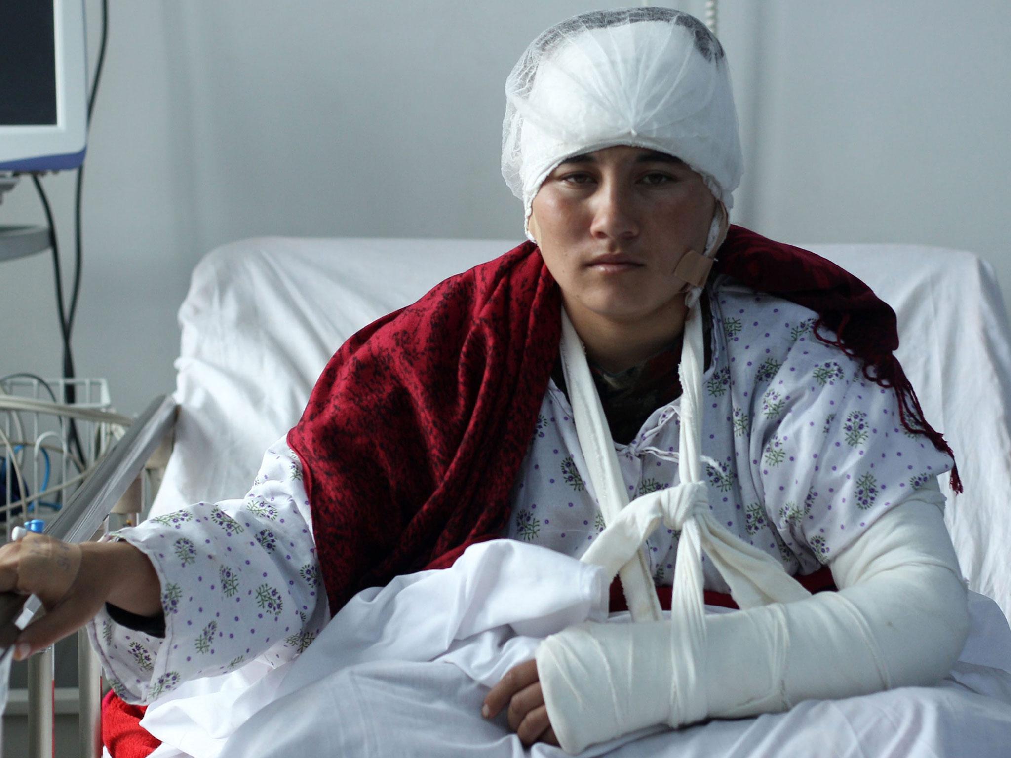 Afghan 23-year old Zarina, whose husband cut off her ears after accusing her of speaking to strange men, receives medical treatment at local hospital in Mazar-e-Sharif, Afghanistan, 3 February, 2017
