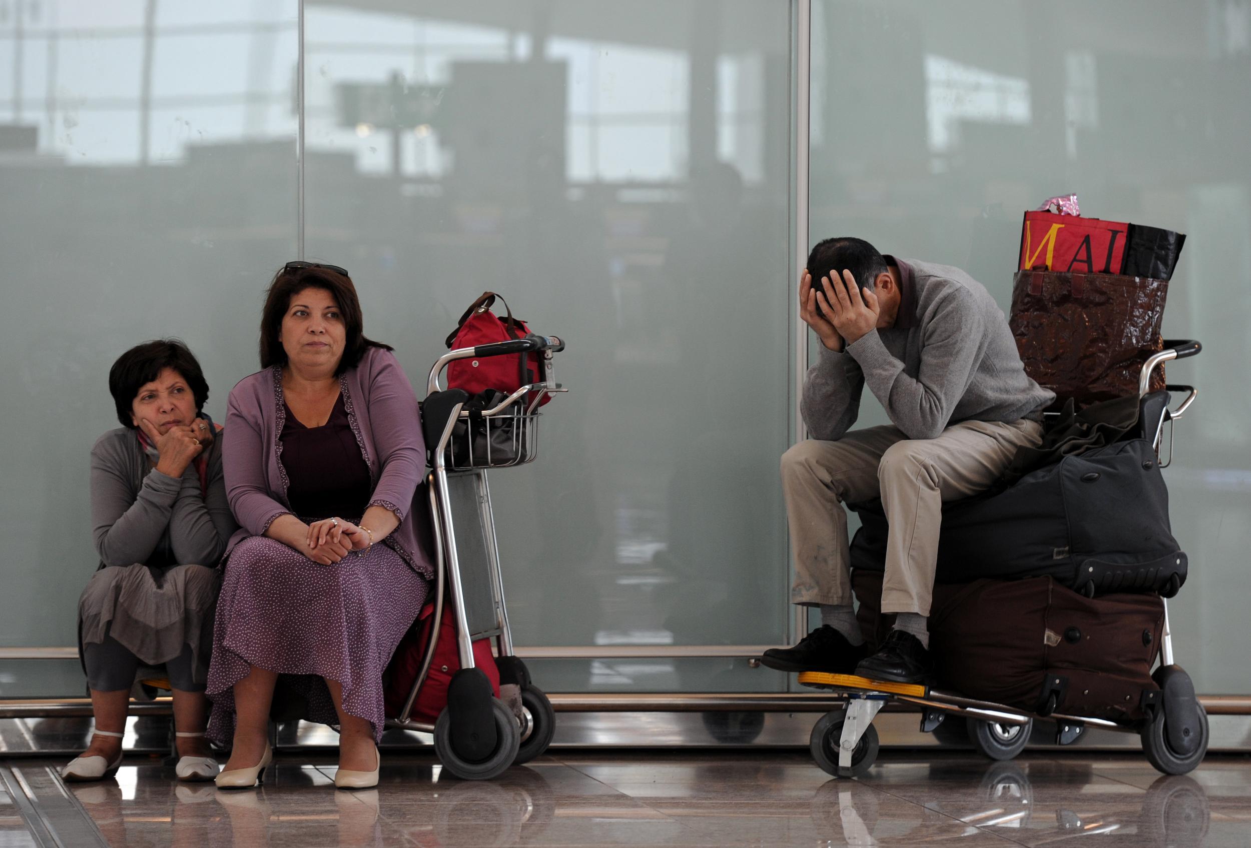 Make sure you have a happy holiday face, unlike these delayed passengers