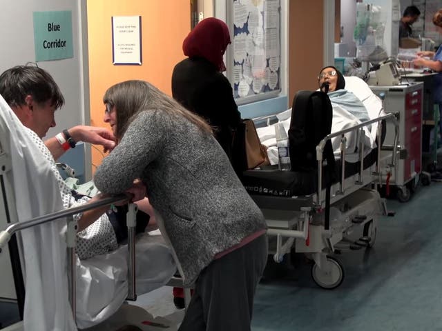 <p>Patients in a hospital corridor awaiting treatment</p>