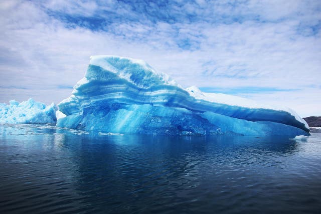 Calved icebergs from the nearby Twin Glaciers are seen floating on the sea off Qaqortoq, Greenland