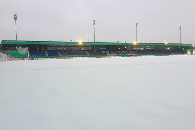 The pitch was covered in several centimetres of snow on Wednesday morning