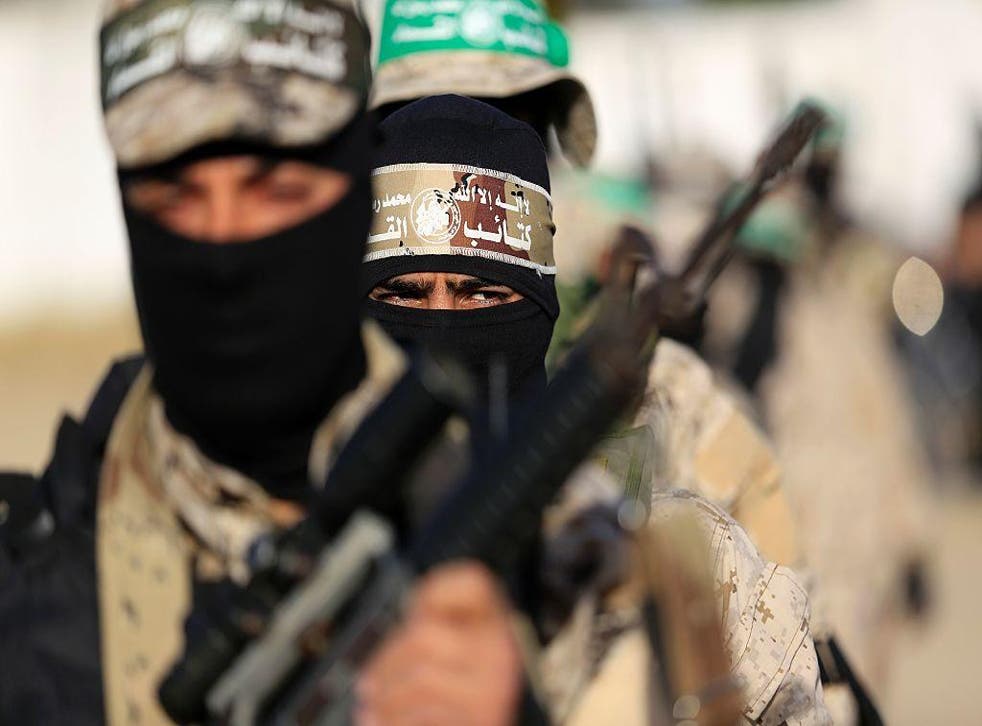 Palestinian militants of the Hamas movement take part in a rally in Gaza