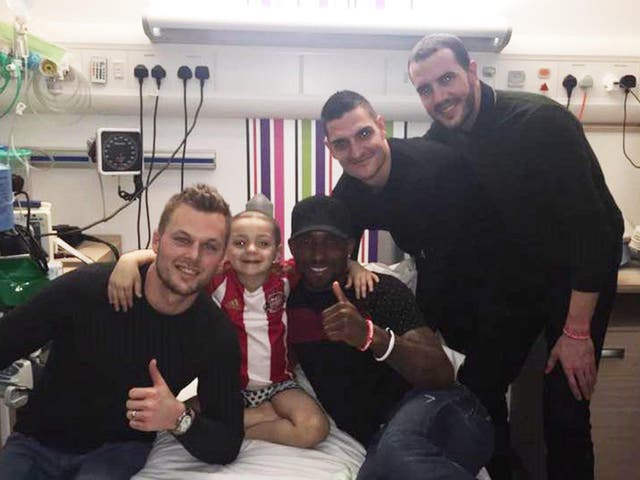 Bradley, 5, poses with (from left) Seb Larsson, Jermain Defoe, Vito Mannone and John O’Shea