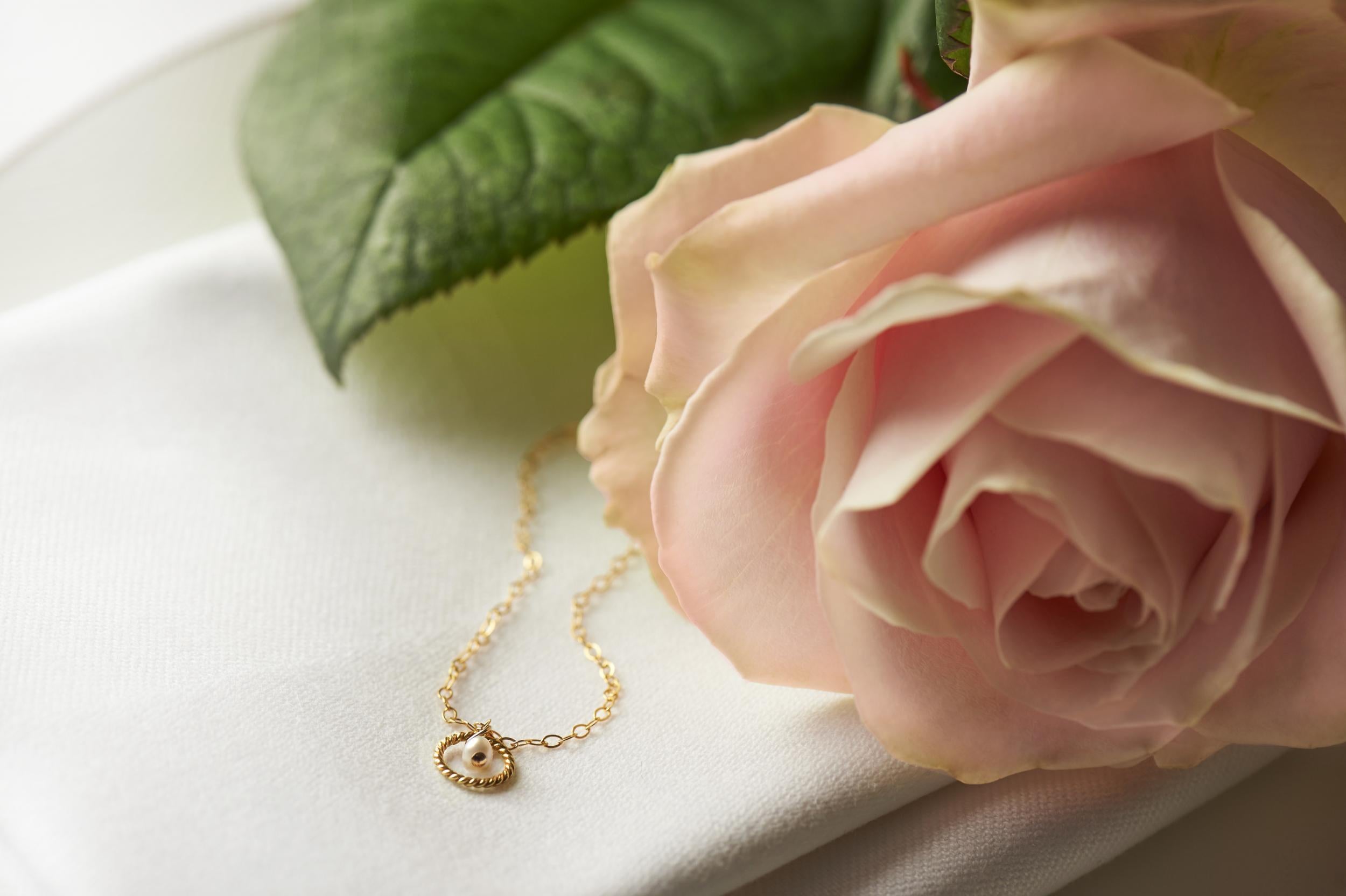 Storey by Storey’s 14k gold filled pendant and chain, also known as Love Knot bracelet