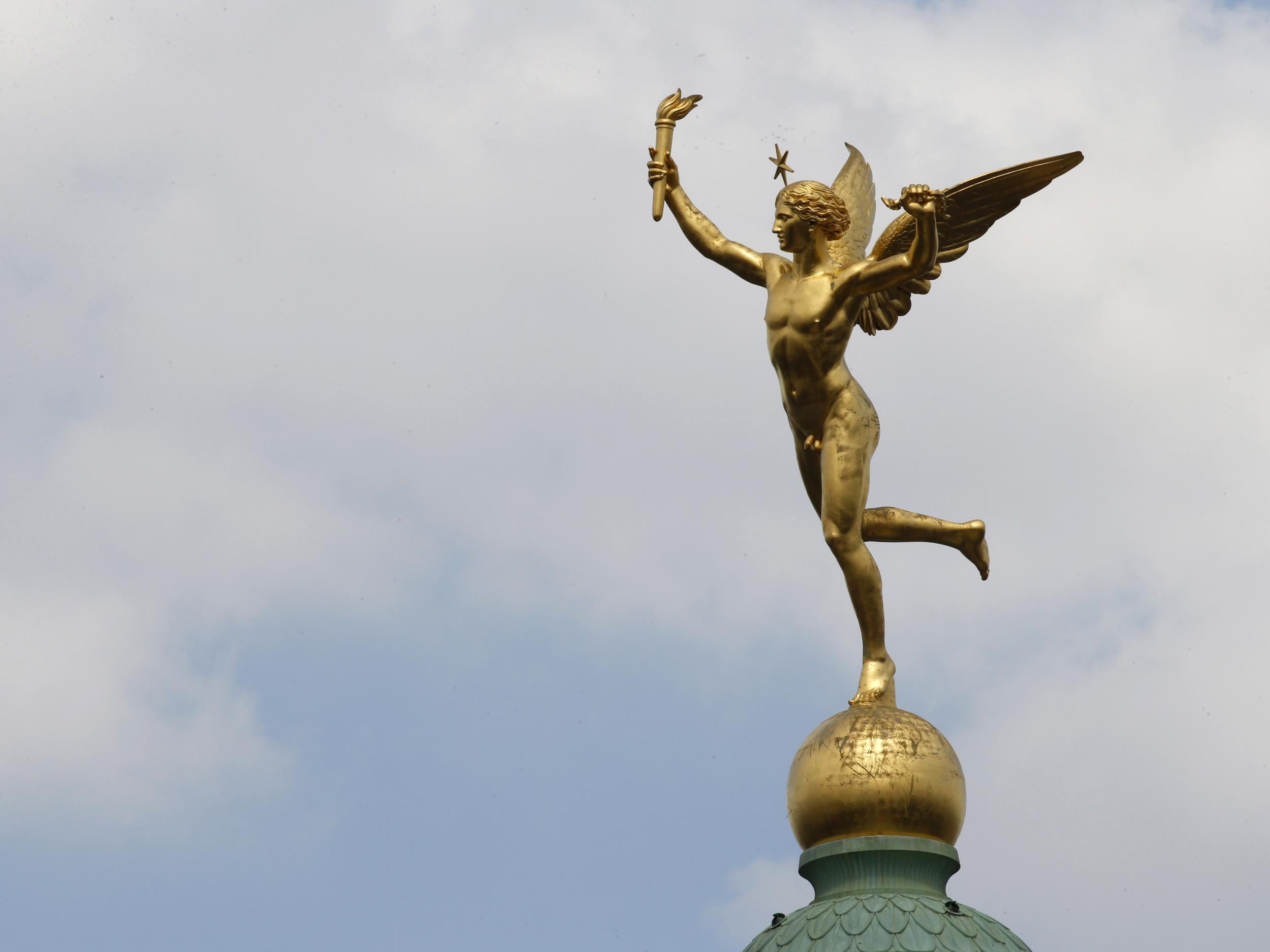 The Genie de la Liberte on the top of the July Column at the Place de la Bastille square in Paris