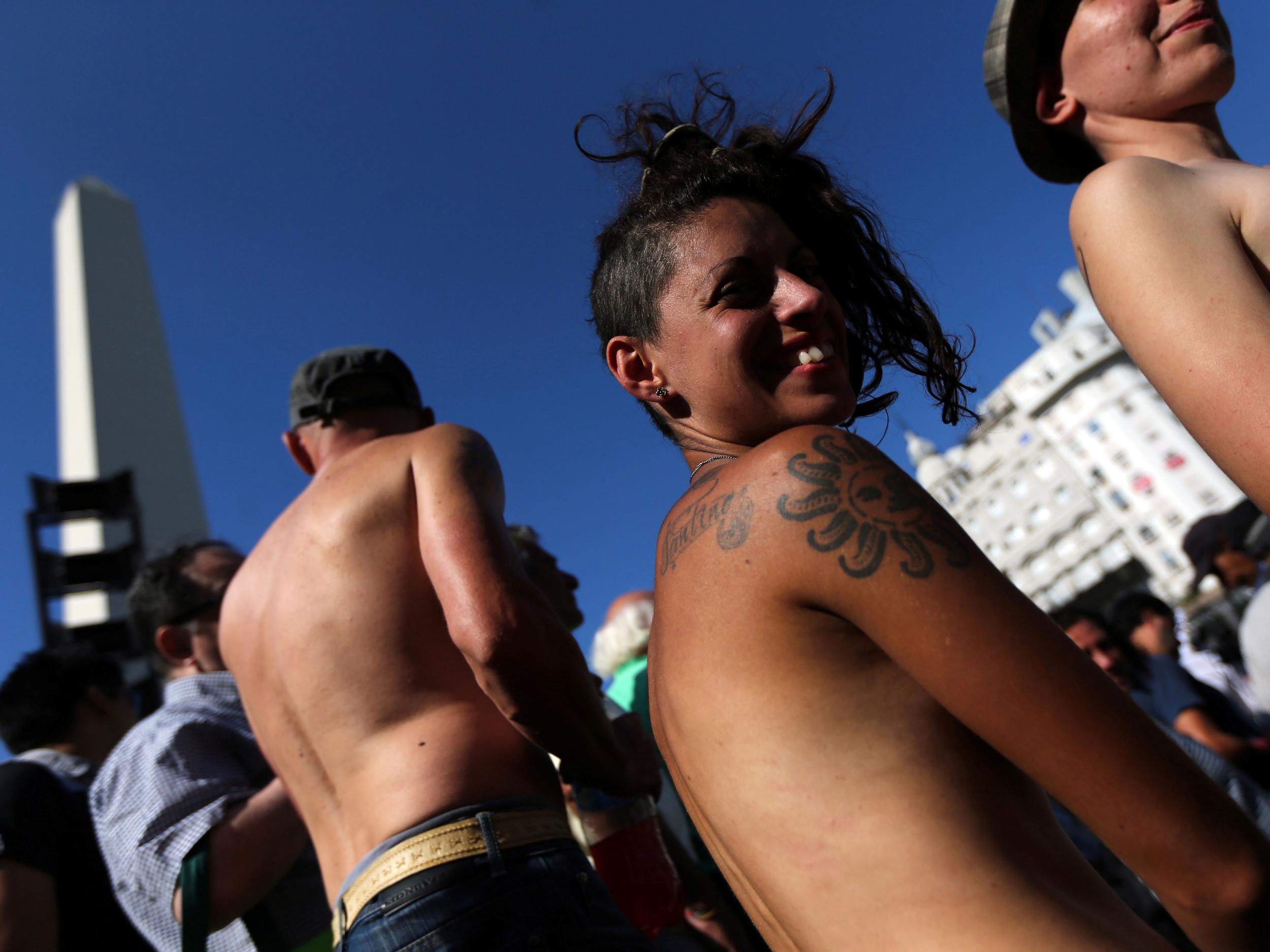 Women in Argentina protest topless for the right to sunbathe in the nude |  The Independent | The Independent