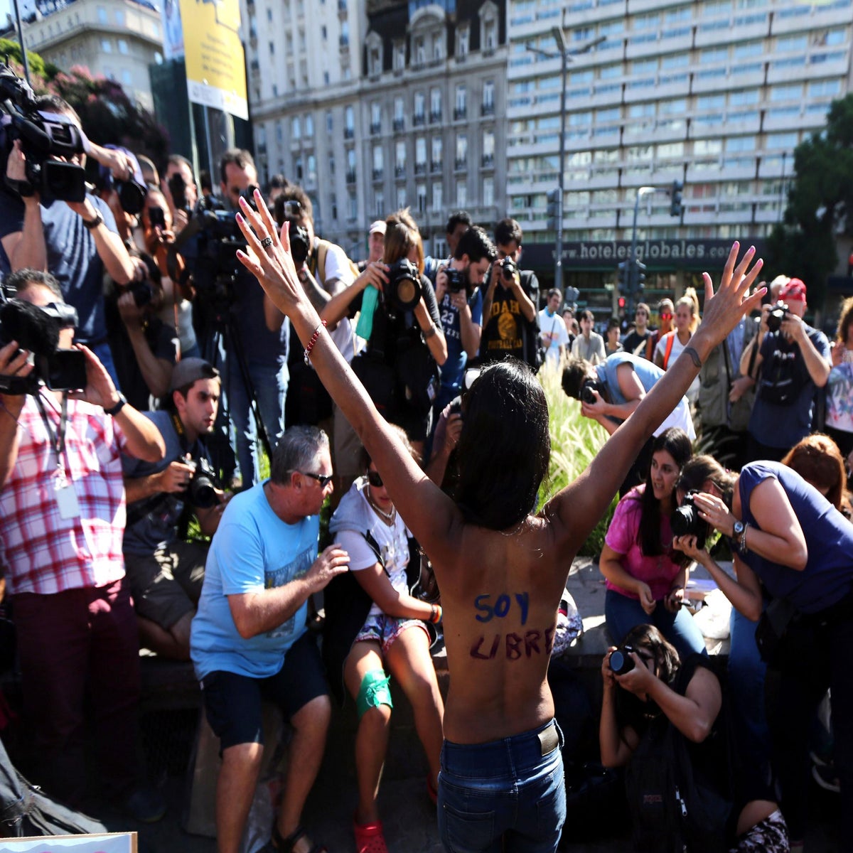 Women in Argentina protest topless for the right to sunbathe in the nude |  The Independent | The Independent