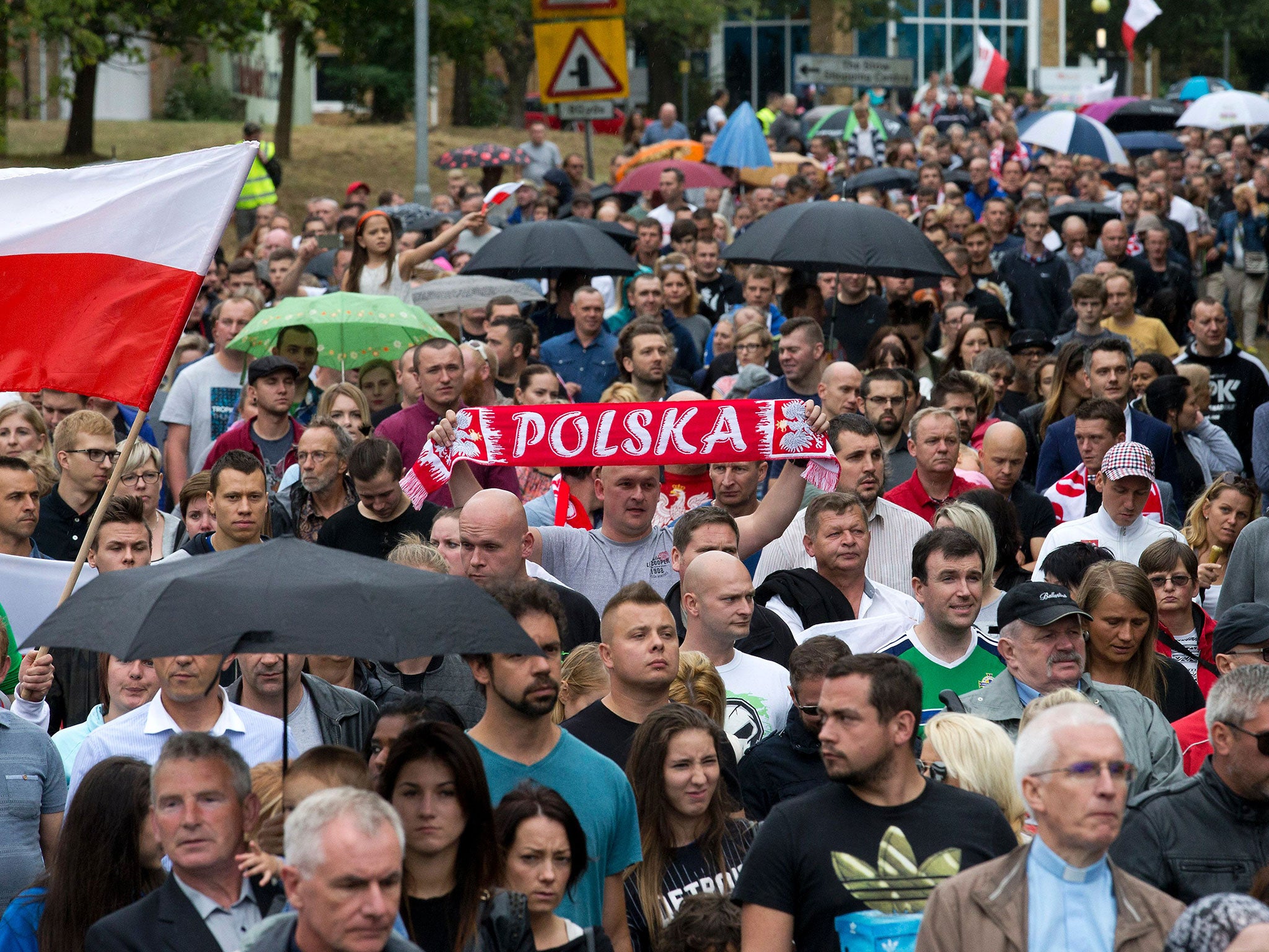 Members of the Polish community march through Harlow exactly a week after the killing of Arek Jóźwik