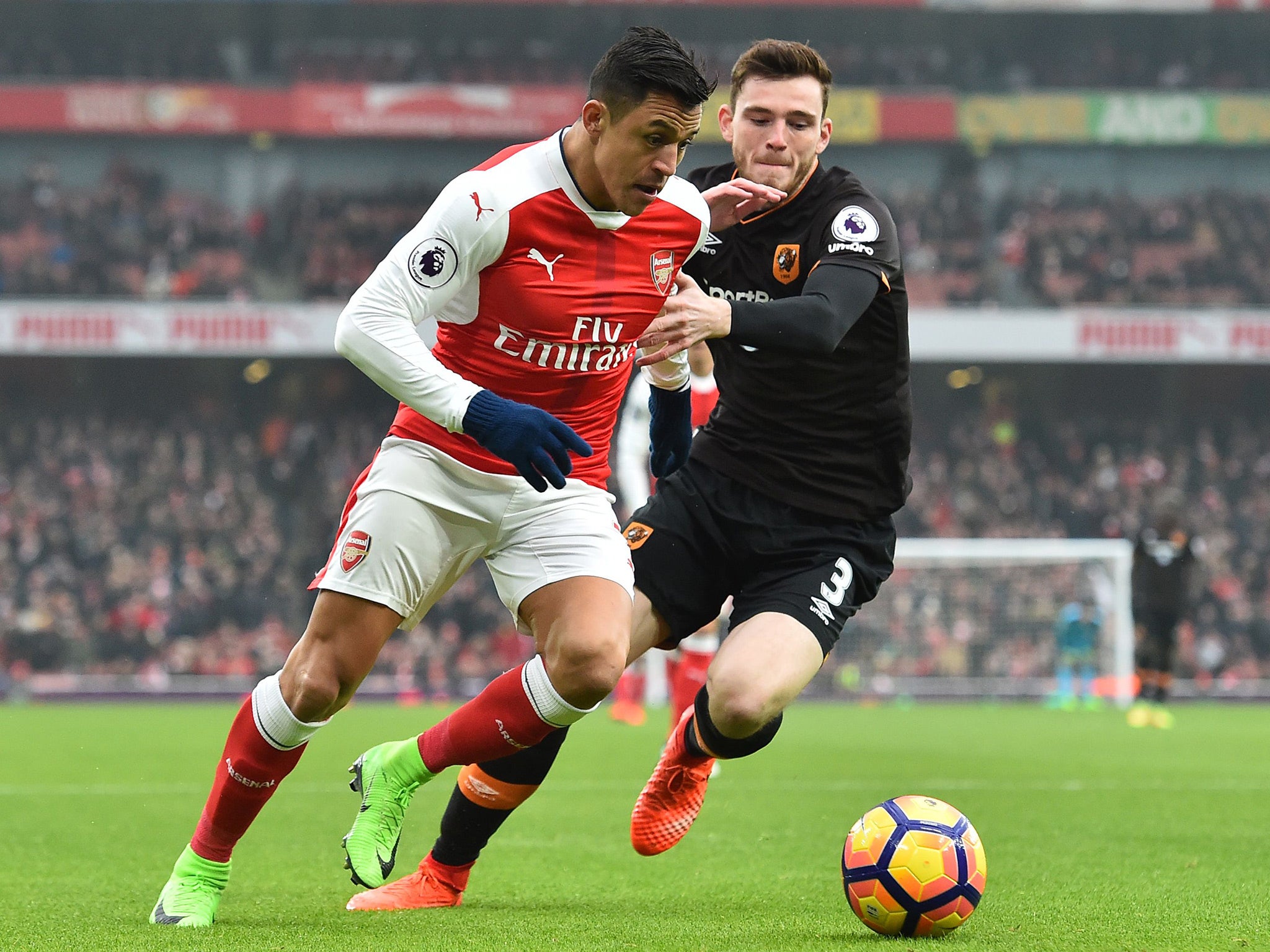 Alexis Sanchez beats Hull's Andrew Robertson on the outside