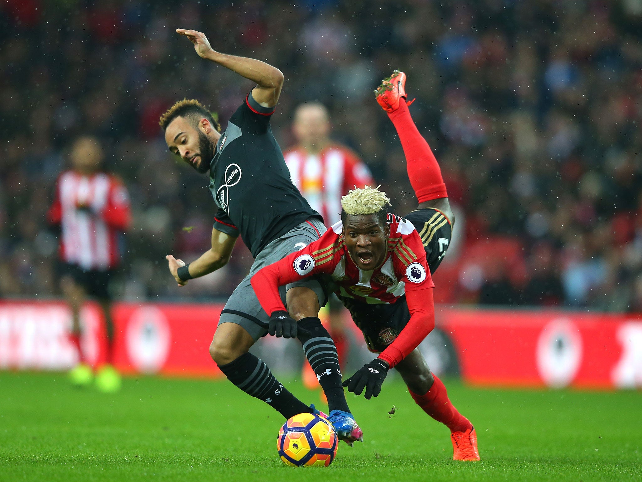 Dider N'dong is sent flying following a challenge from Nathan Redmond