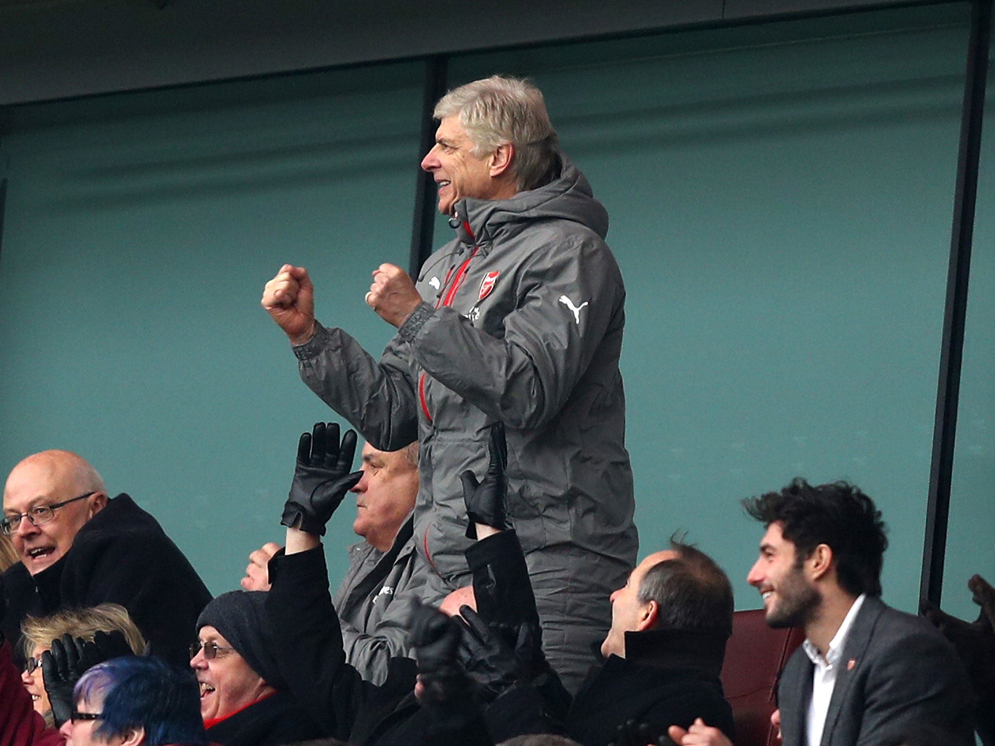 Wenger celebrates after his side's first goal at the Emirates Stadium