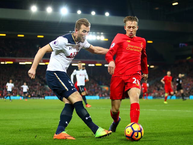 Harry Kane and Lucas battle for the ball in the opening stages at Anfield
