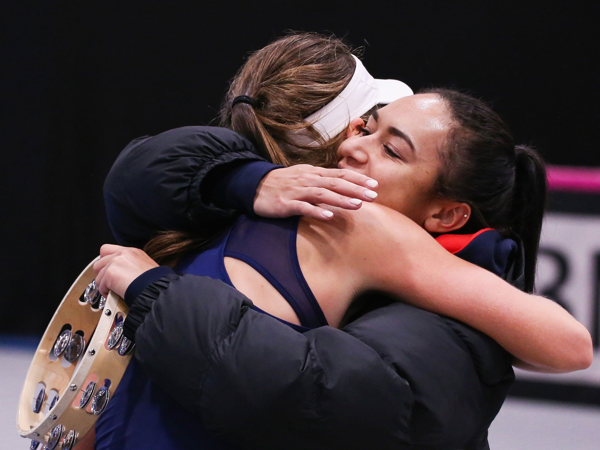 Johanna Konta and Heather Watson embrace after securing victory