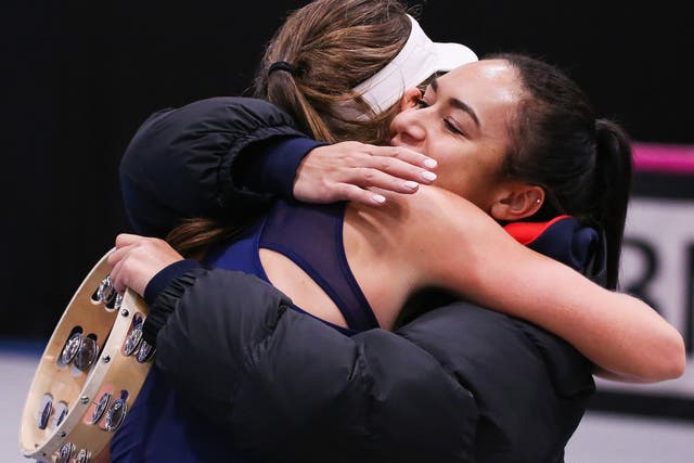Johanna Konta and Heather Watson embrace after securing victory