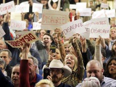 Republican town halls attract swarming crowds and hostile questions
