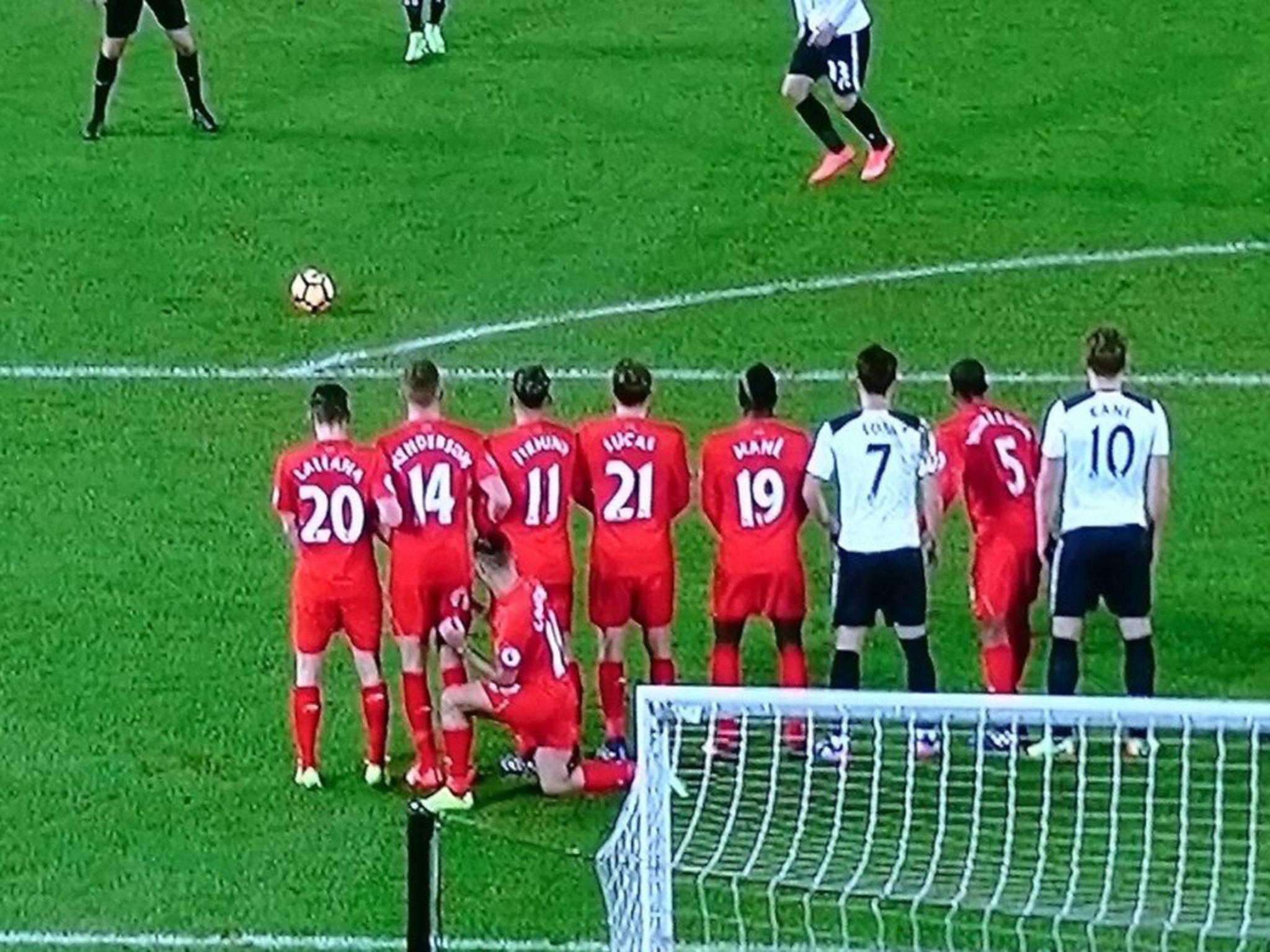 Philippe Coutinho was spotted kneeling behind the wall in order to prevent Christian Eriksen from shooting low